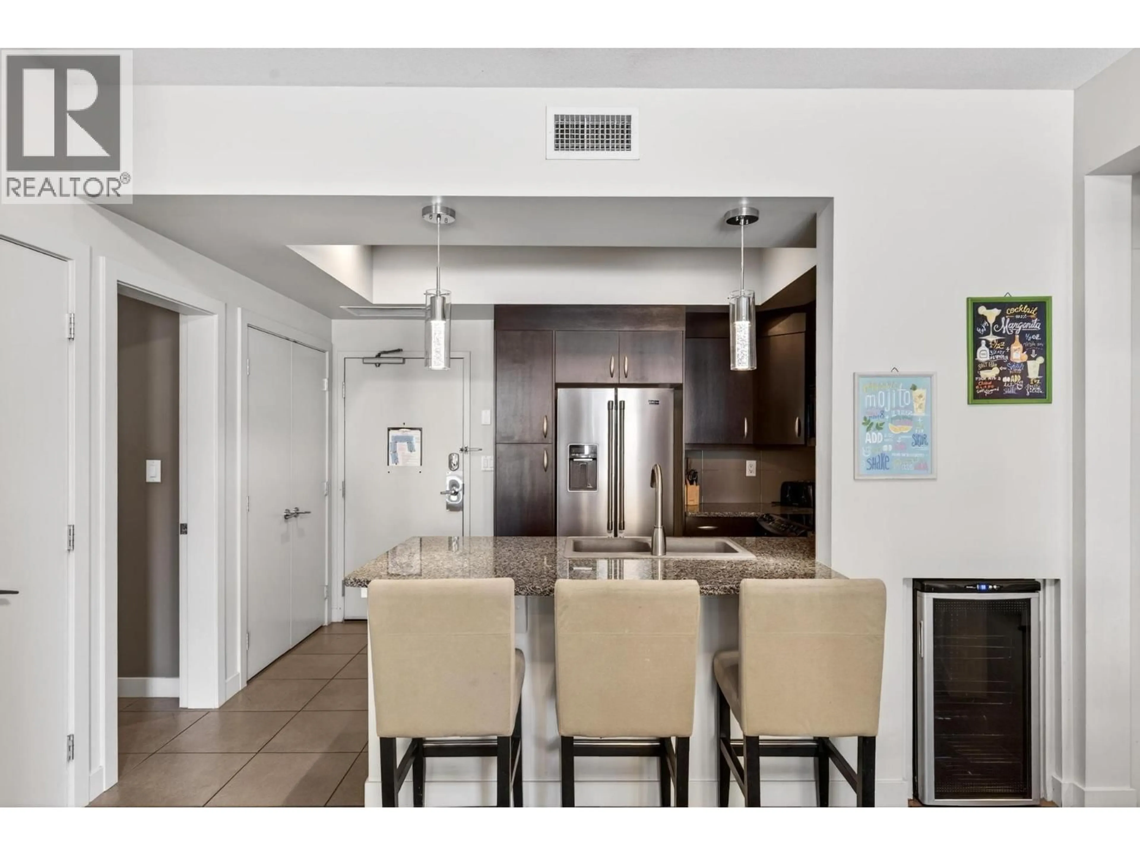 Open concept kitchen, ceramic/tile floor for 1117 - 7343 OKANAGAN LANDING ROAD, Vernon British Columbia V1H2J6