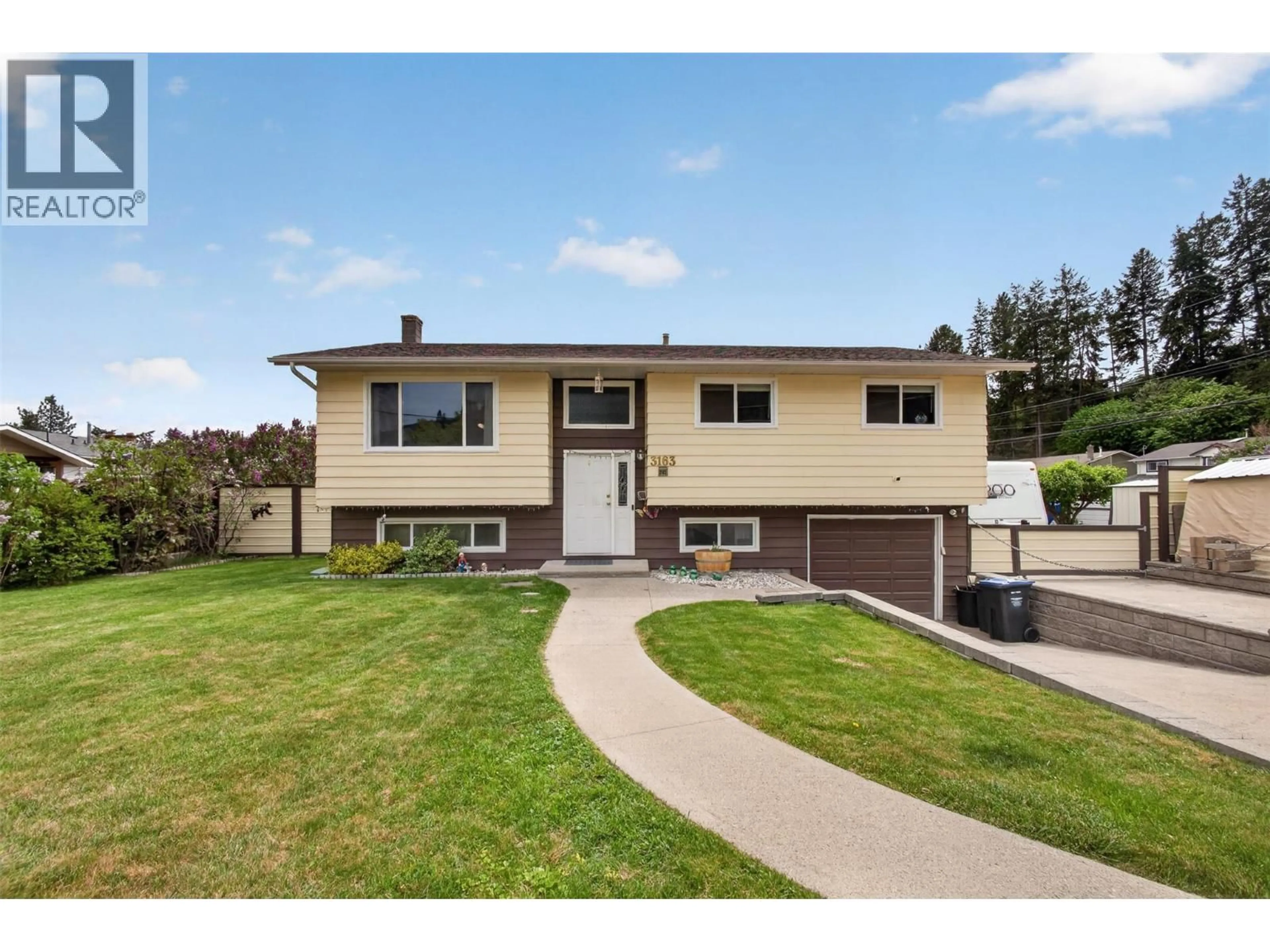 Home with vinyl exterior material, street for 3163 MCCOY ROAD, West Kelowna British Columbia V4T1A8