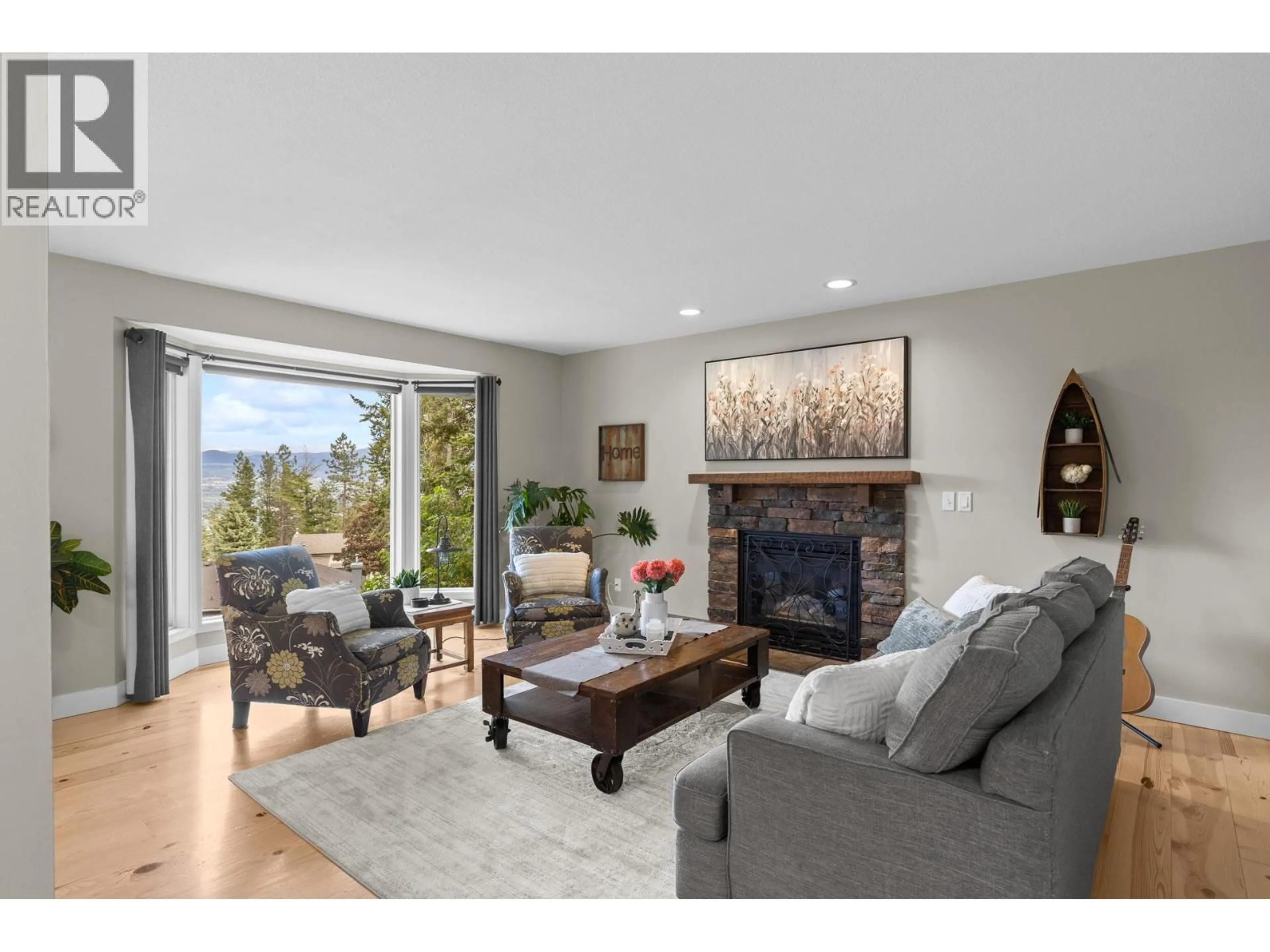 Living room with furniture, wood/laminate floor for 1603 WEST KELOWNA ROAD, West Kelowna British Columbia V1Z3H5