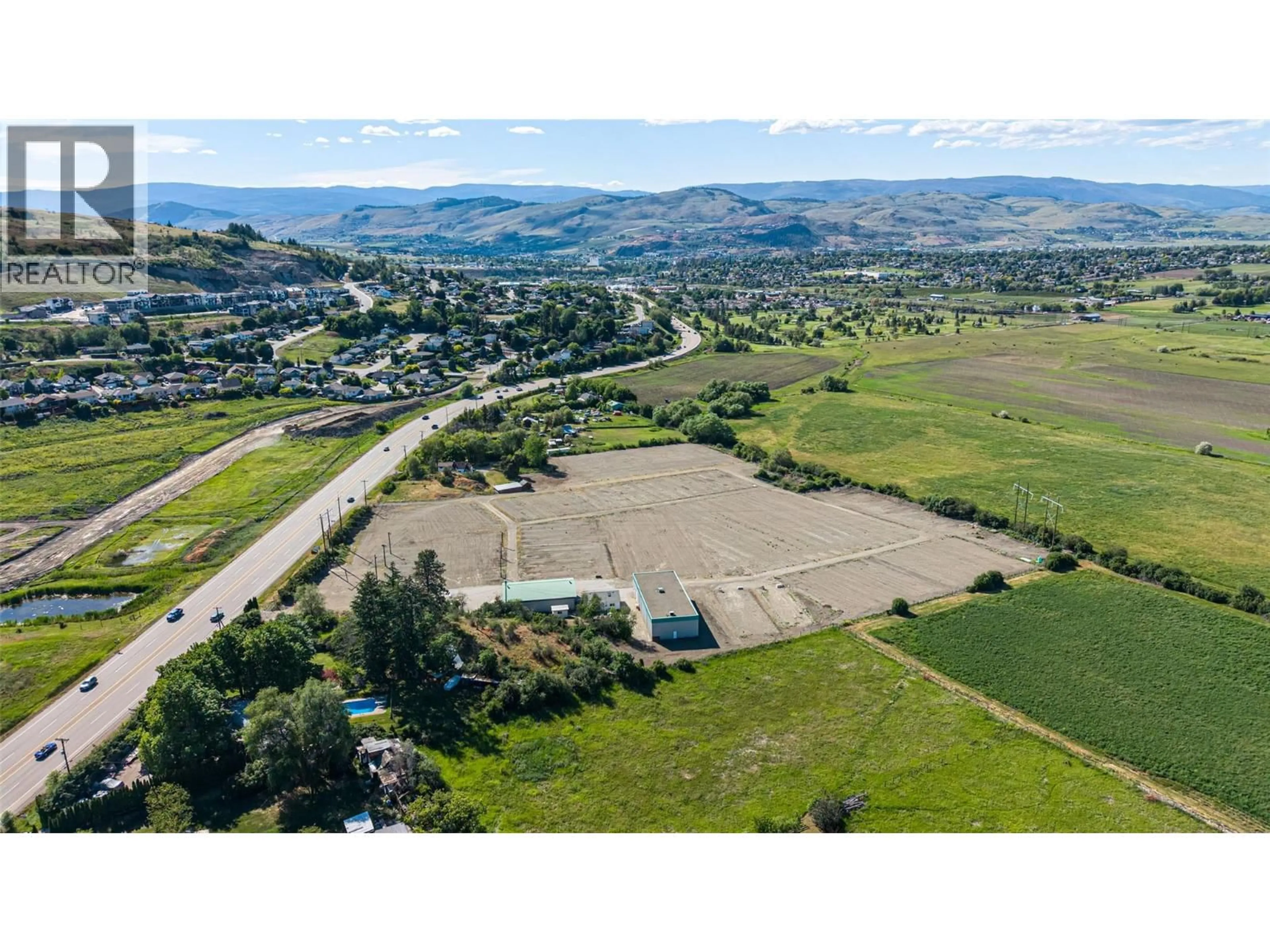A pic from outside/outdoor area/front of a property/back of a property/a pic from drone, mountain view for 10003 6 HIGHWAY, Coldstream British Columbia V1B3B6