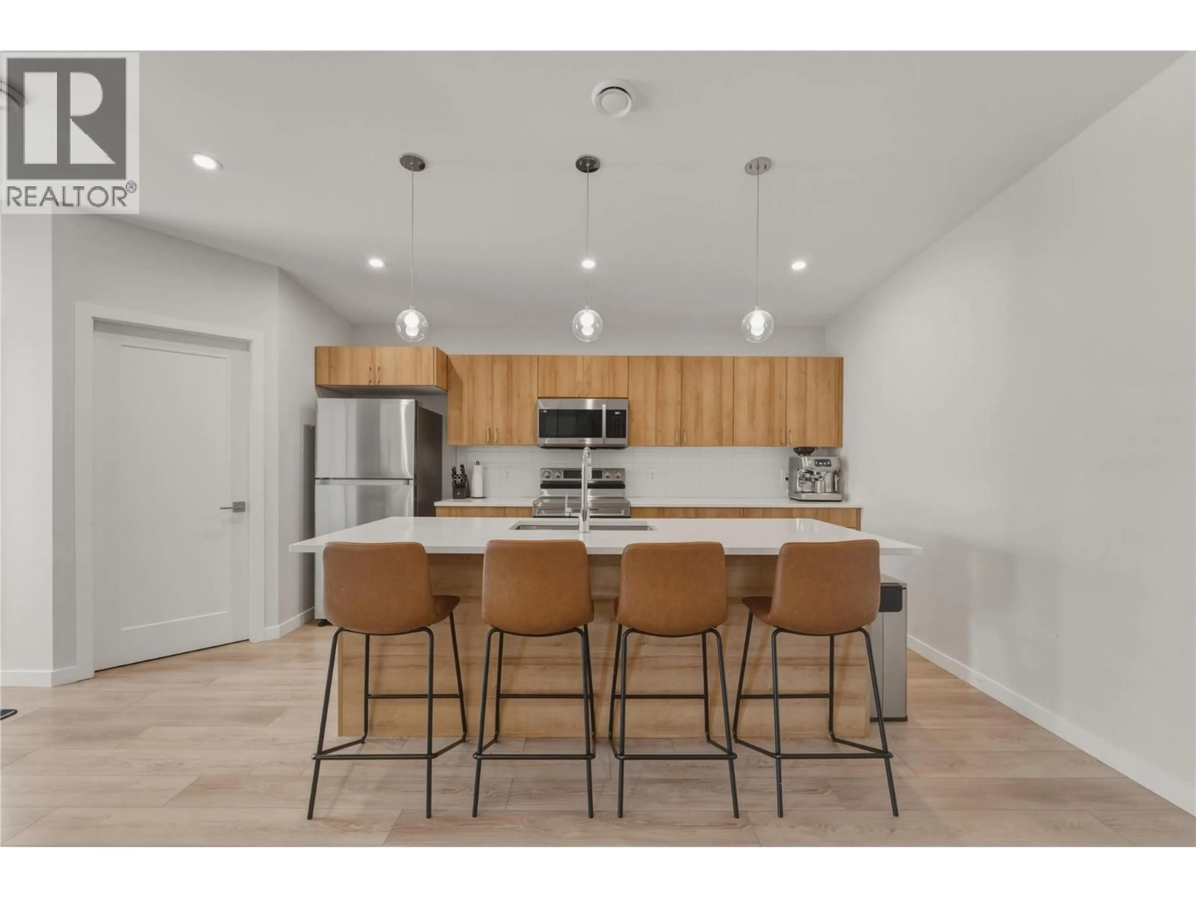 Open concept kitchen, wood/laminate floor for 32 - 8900 JIM BAILEY ROAD, Lake Country British Columbia V4V0B5