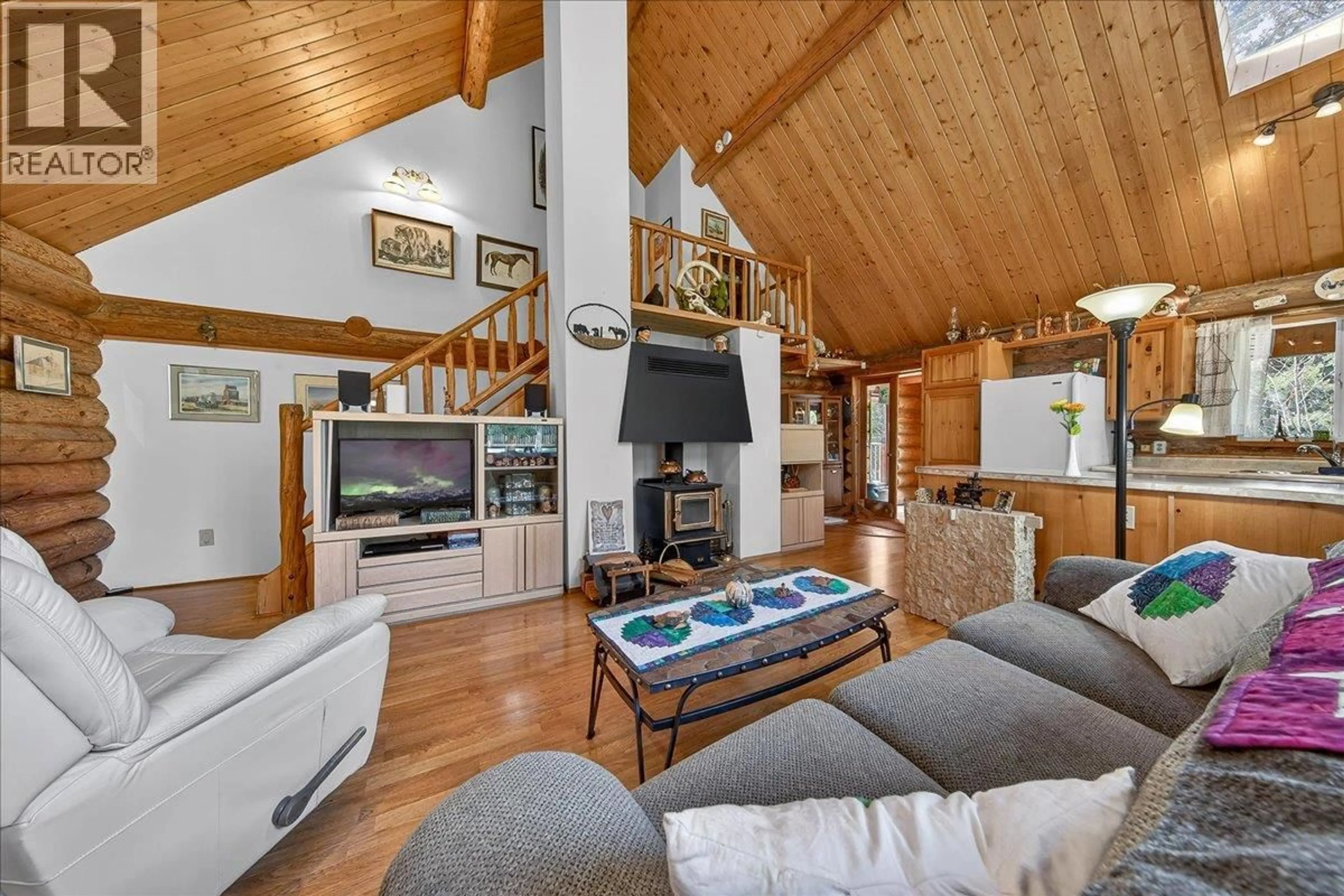 Living room with furniture, wood/laminate floor for 4898 SABLE ROAD, Fairmont Hot Springs British Columbia V0B1L1