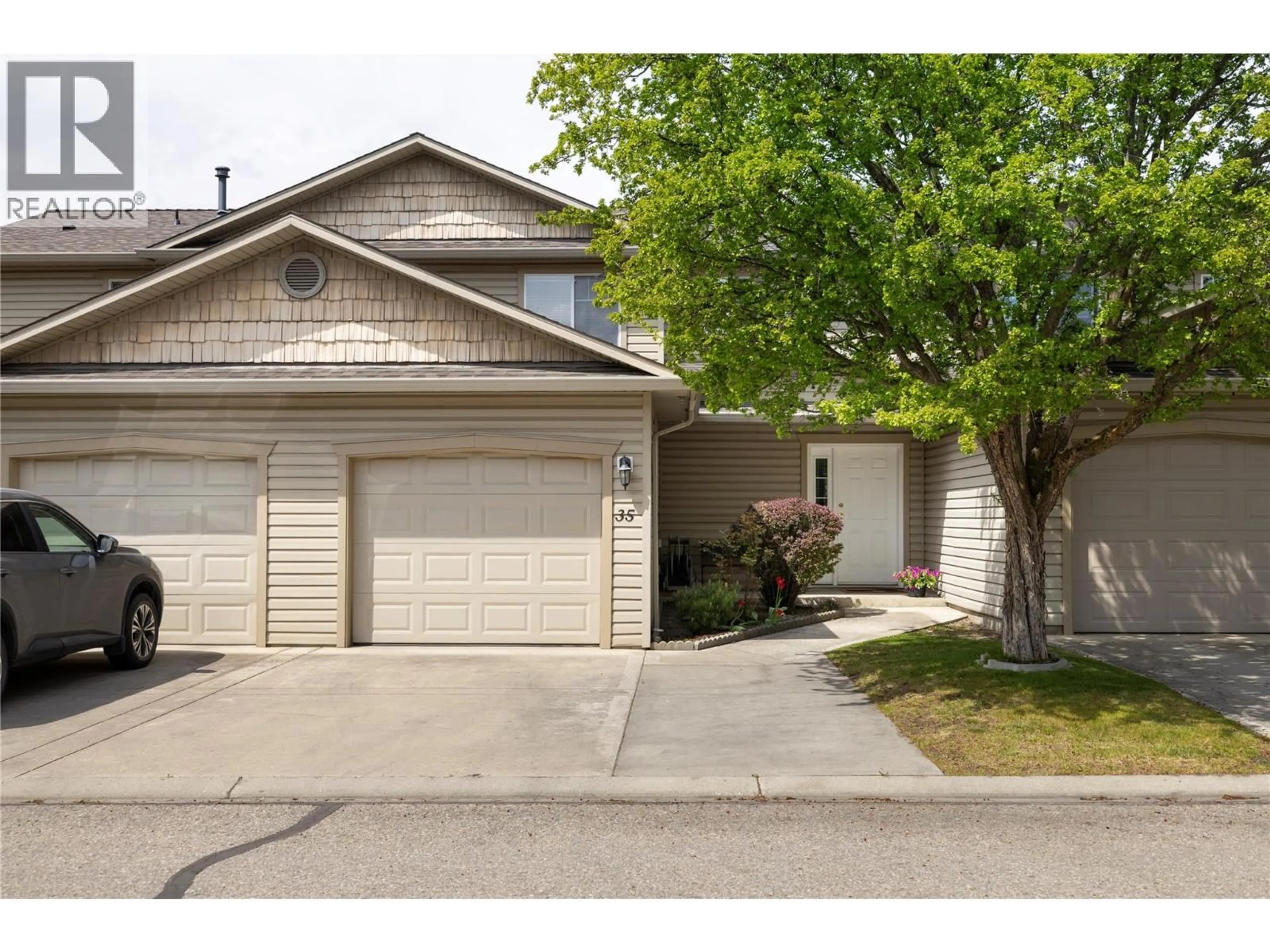 Home with vinyl exterior material, street for 35 - 5886 OKANAGAN LANDING ROAD, Vernon British Columbia V1H1S1