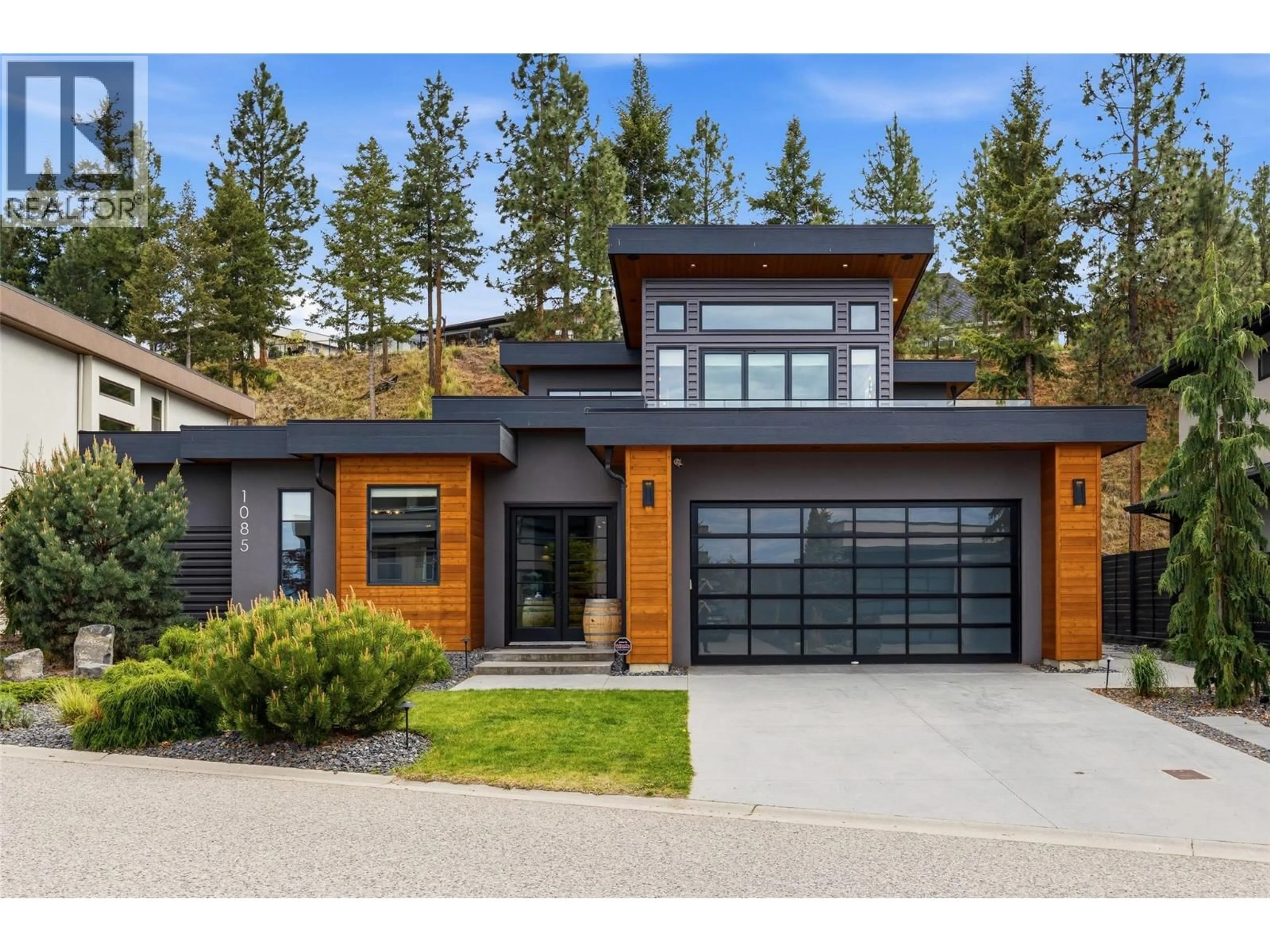 Home with brick exterior material, street for 1085 WESTPOINT DRIVE, Kelowna British Columbia V1W4Z9
