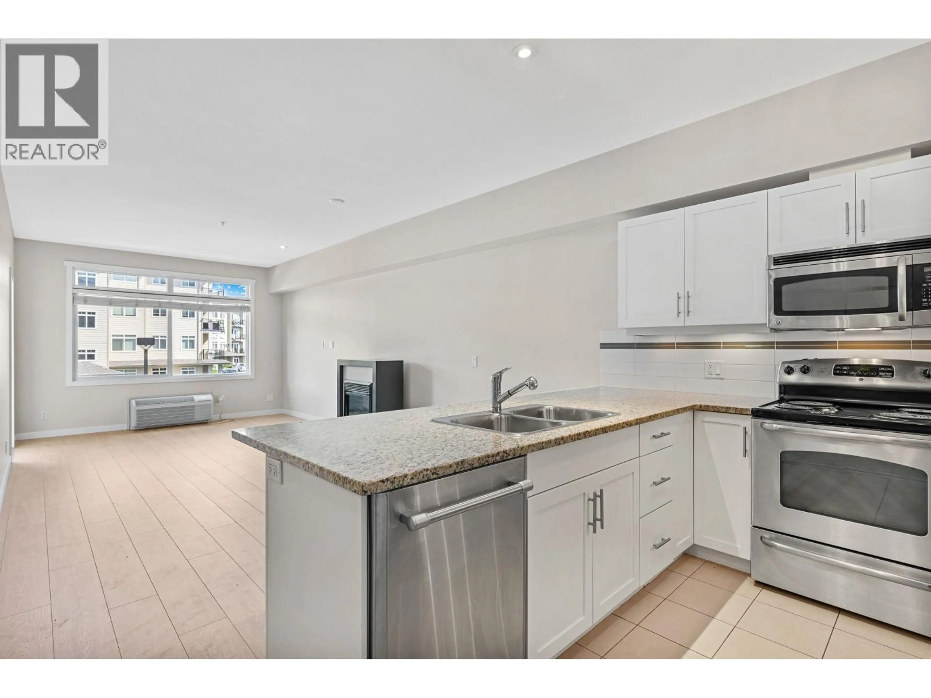 Open concept kitchen, unknown for 202 - 1350 RIDGEWAY DRIVE, Kelowna British Columbia V1Y9T8