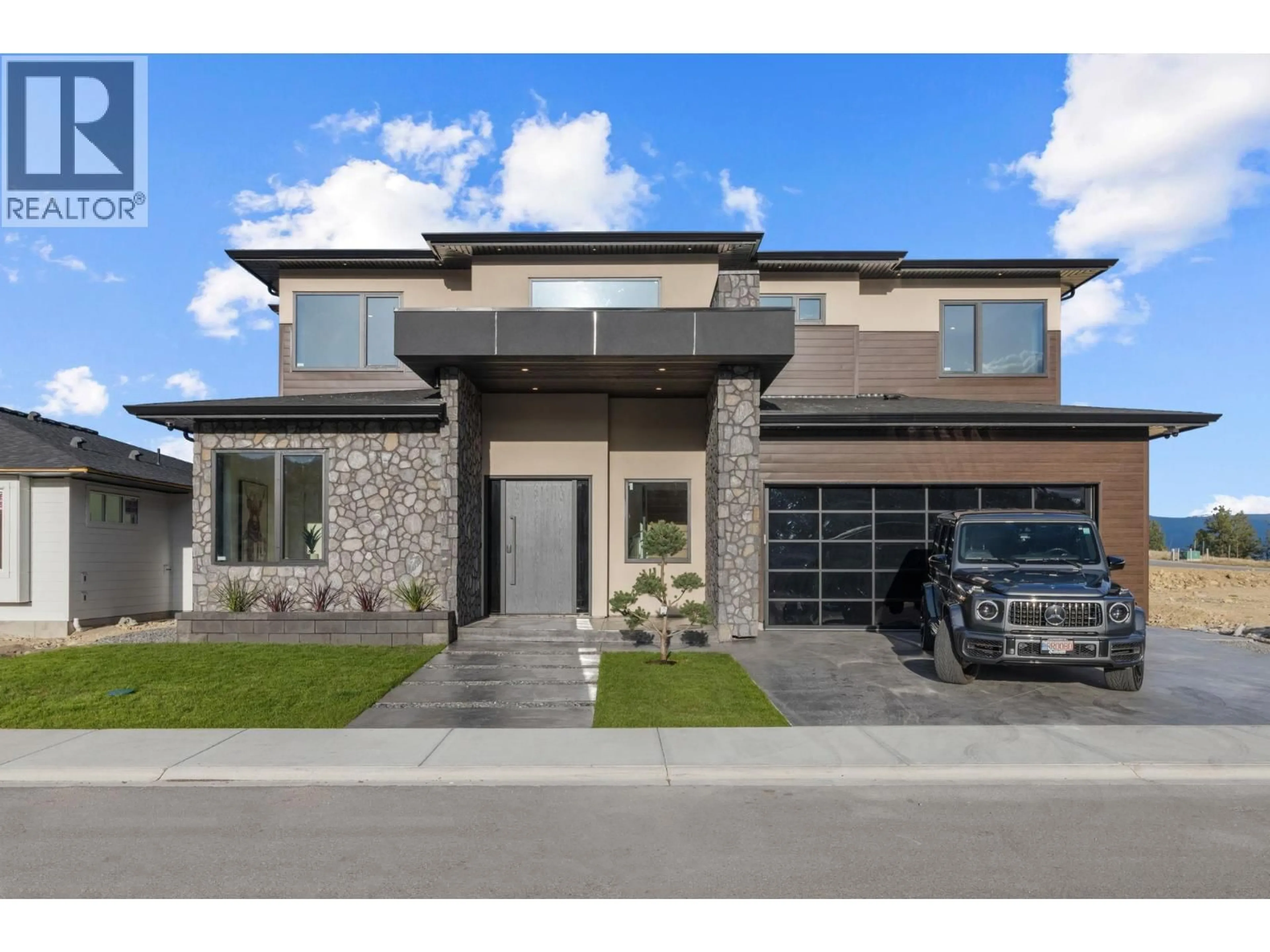 Home with brick exterior material, street for 3079 EAGLE BLUFF DRIVE, West Kelowna British Columbia V4T1Y3