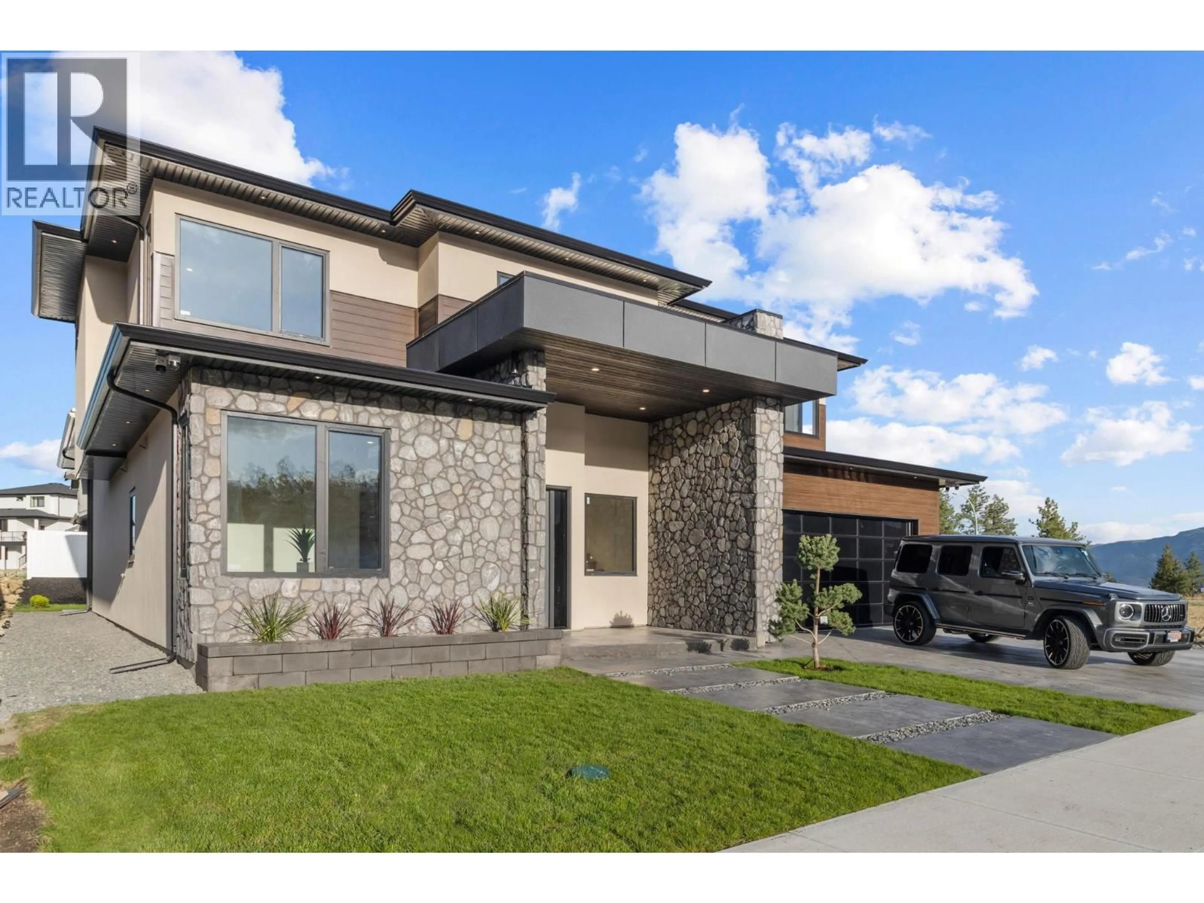 Home with brick exterior material, street for 3079 EAGLE BLUFF DRIVE, West Kelowna British Columbia V4T1Y3