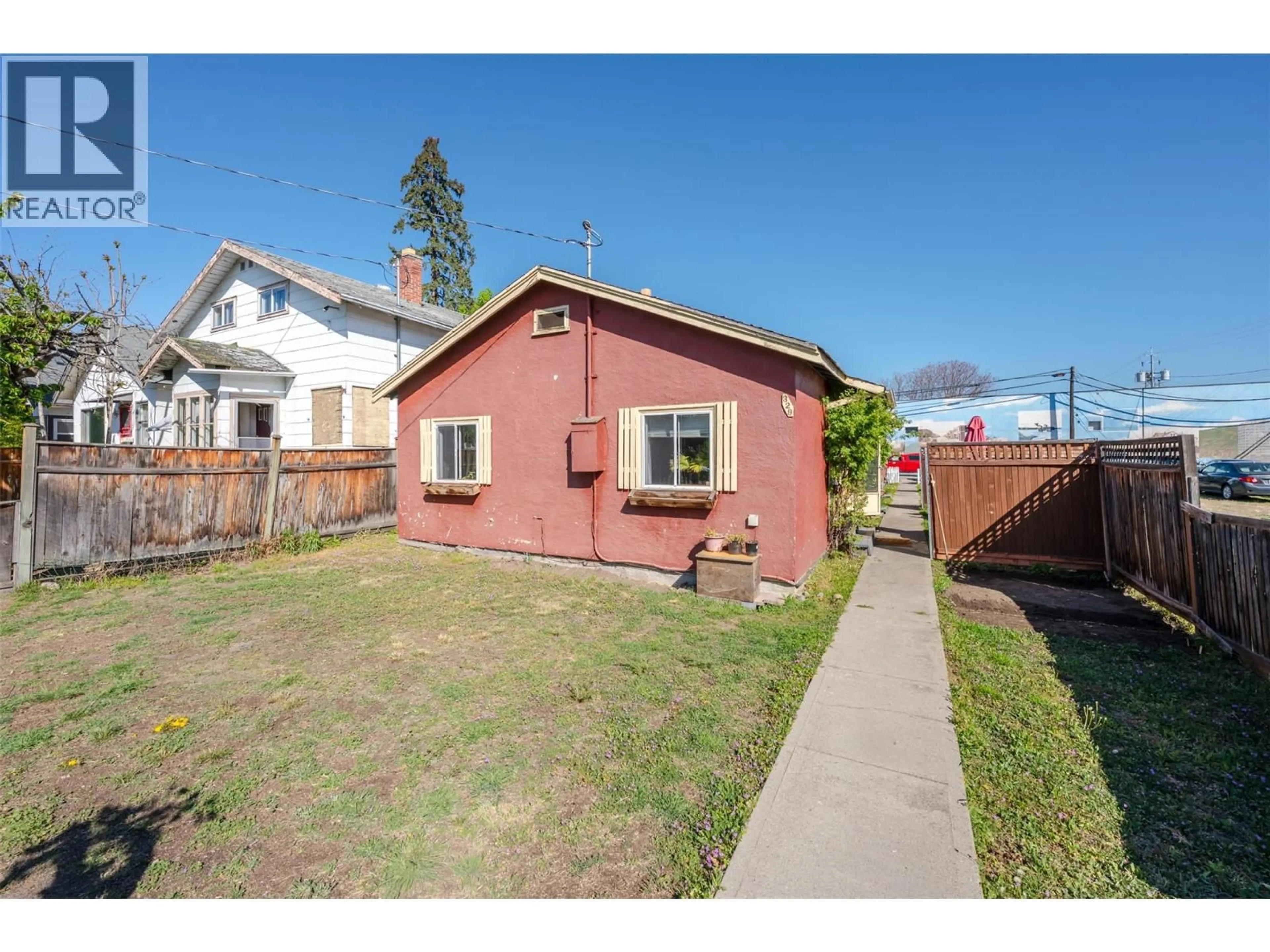A pic from outside/outdoor area/front of a property/back of a property/a pic from drone, street for 329 NANAIMO AVENUE WEST, Penticton British Columbia V2A1N8