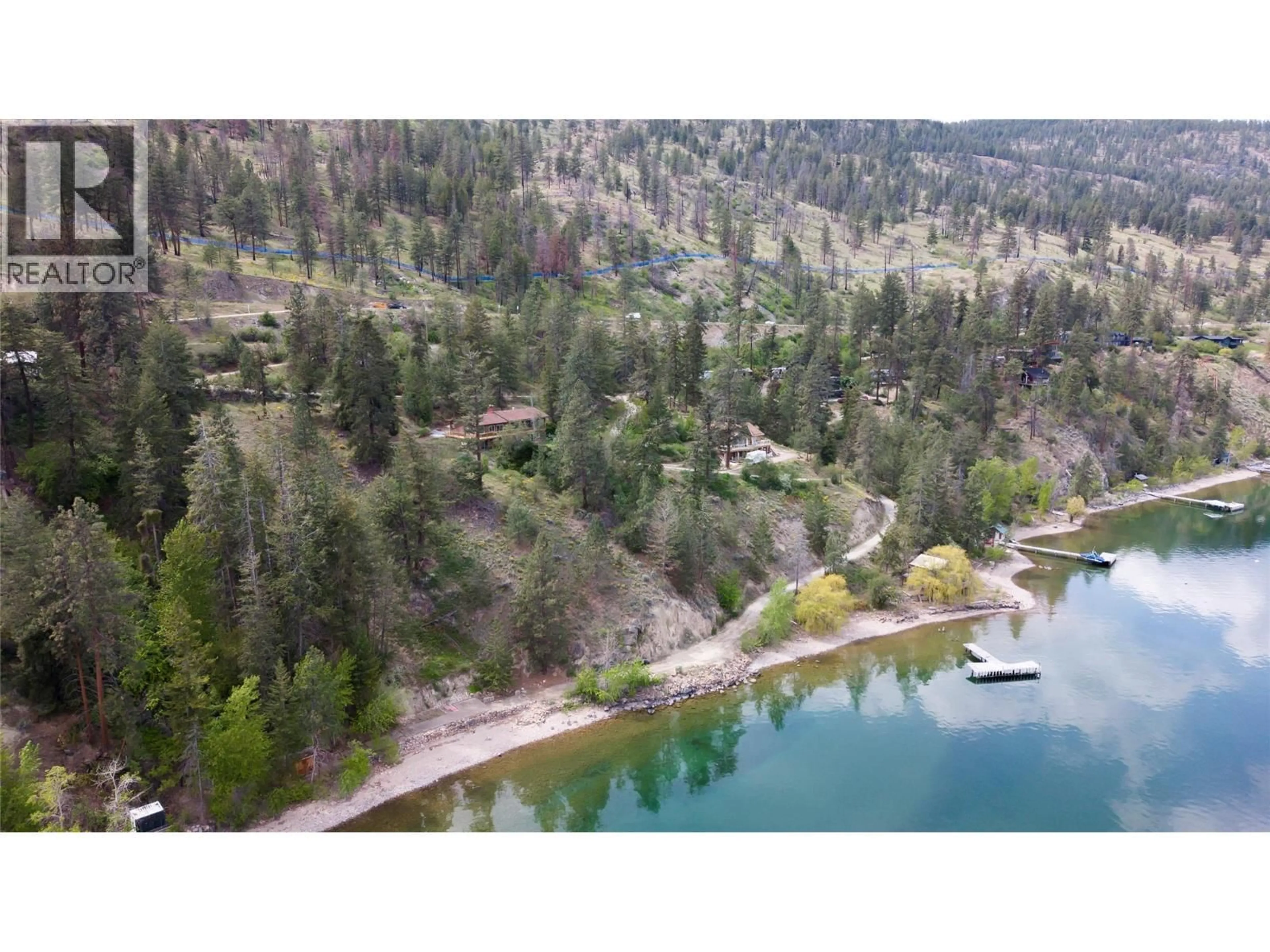 A pic from outside/outdoor area/front of a property/back of a property/a pic from drone, water/lake/river/ocean view for 7260 HIGHWAY 97 OTHER SOUTH, Peachland British Columbia V0H1X9