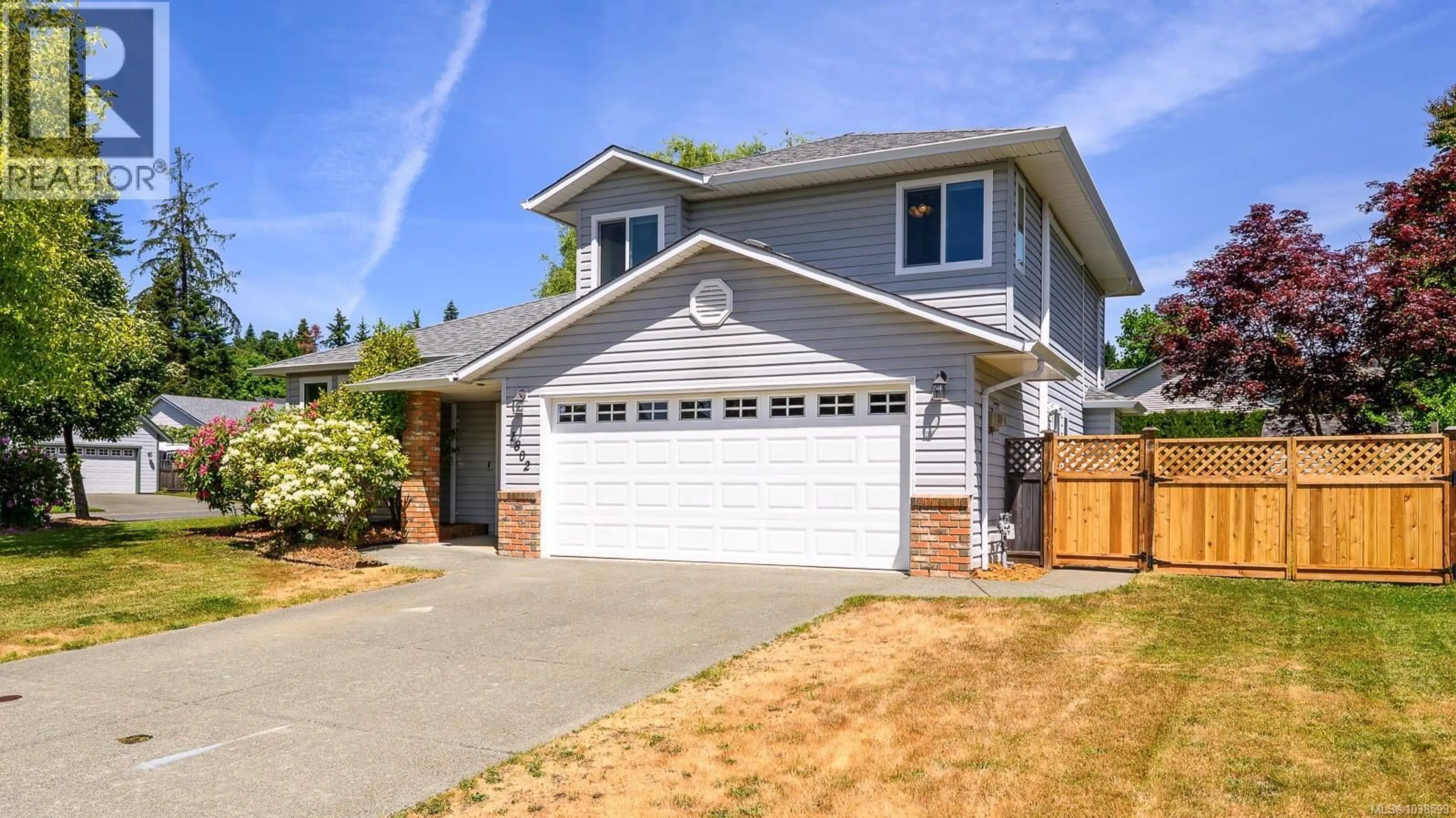 Home with vinyl exterior material, street for 1802 HAWK DRIVE, Courtenay British Columbia V9N8S4
