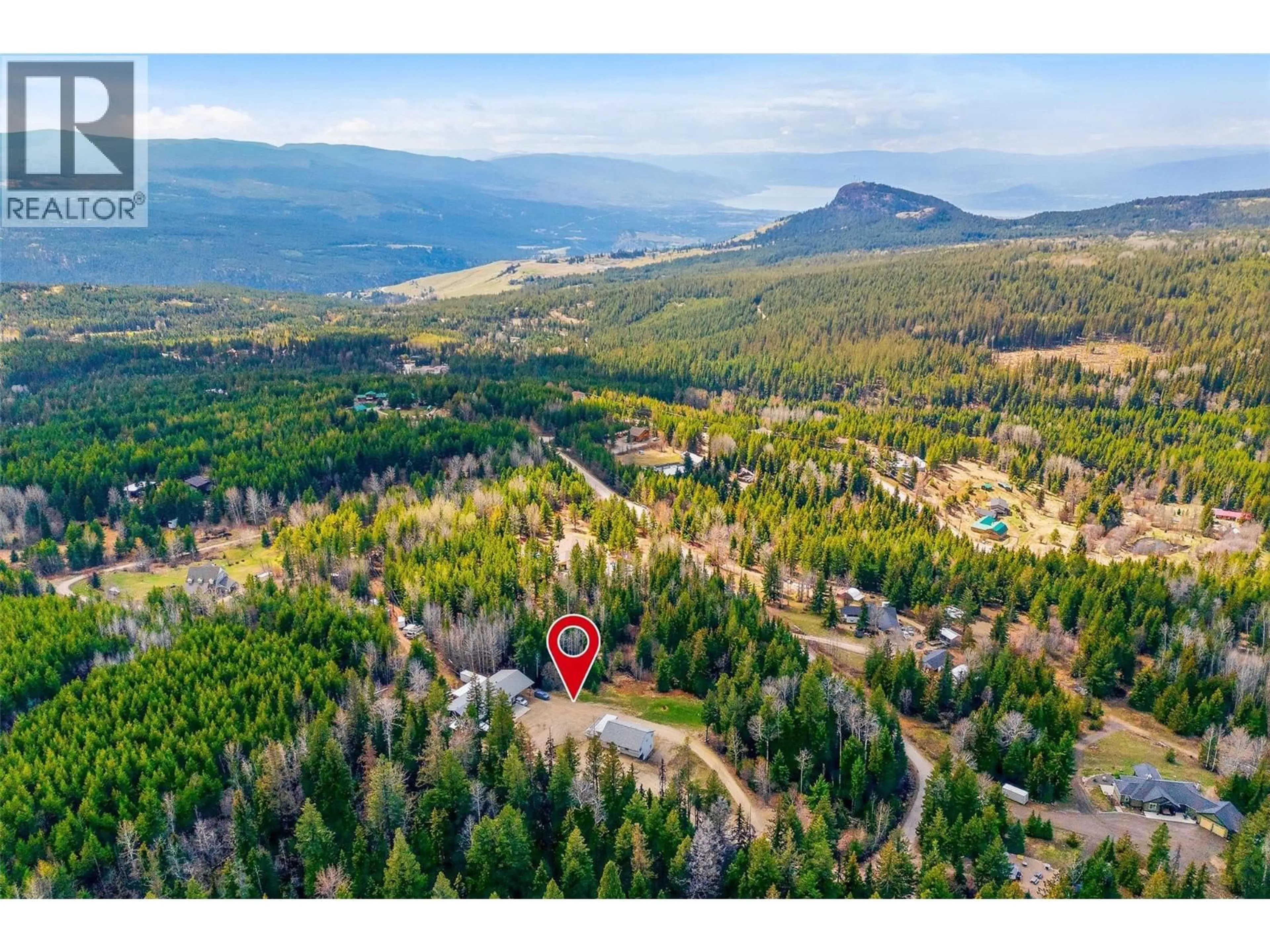 A pic from outside/outdoor area/front of a property/back of a property/a pic from drone, mountain view for 1685 BOONE COURT, Kelowna British Columbia V1P1H7