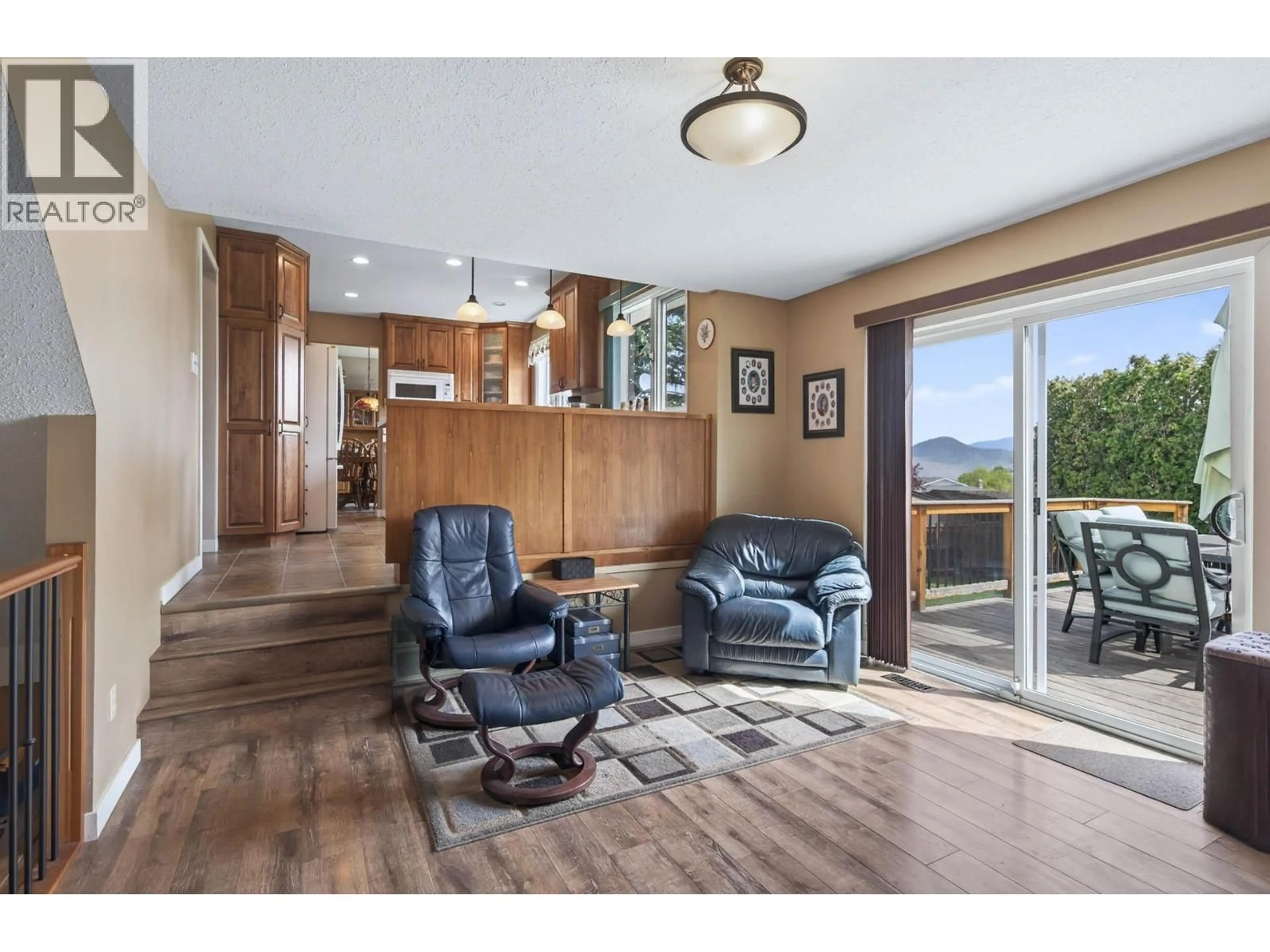 Living room with furniture, wood/laminate floor for 880 FLEMING DRIVE, Kamloops British Columbia V1S1B3