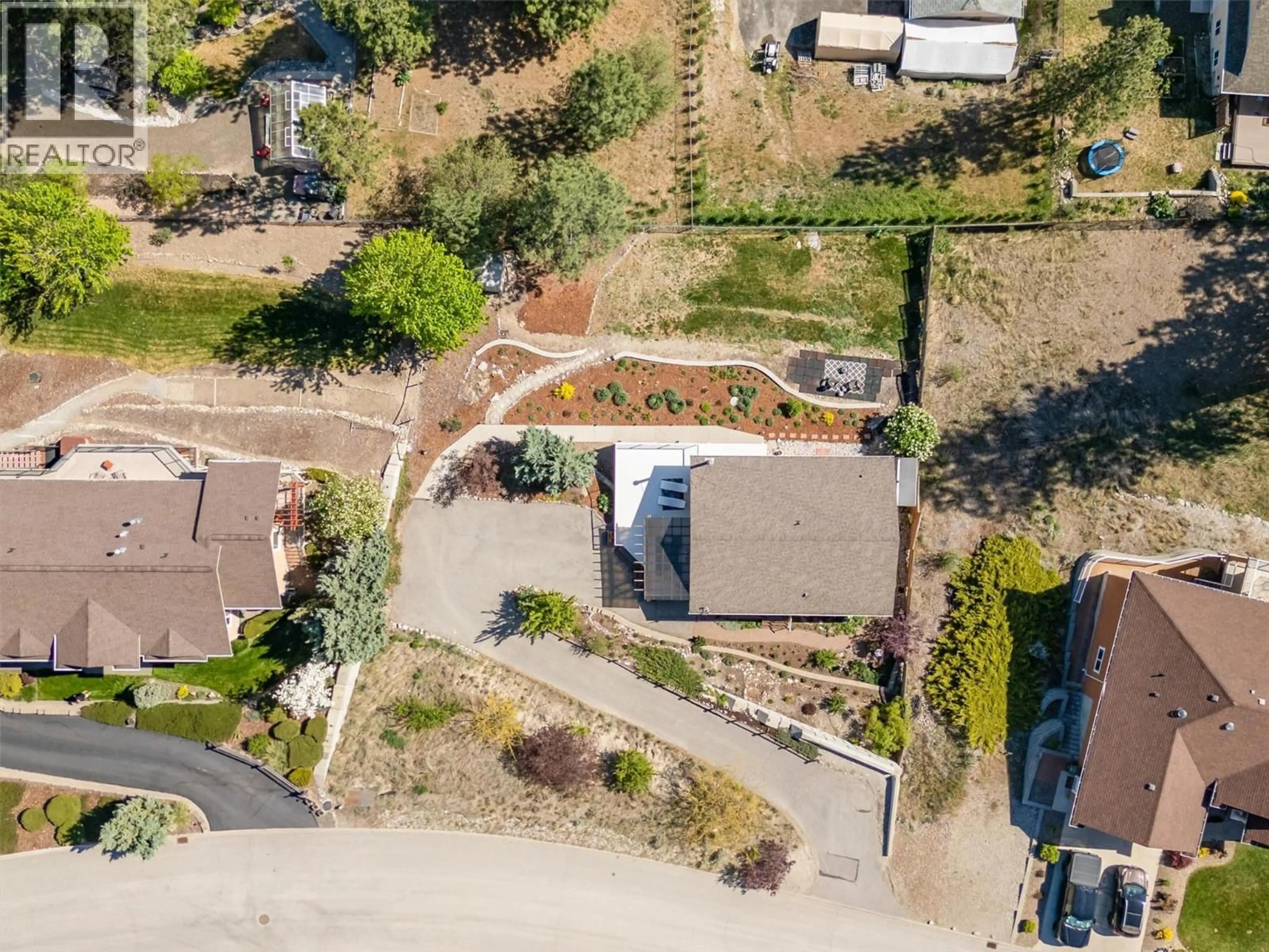 A pic from outside/outdoor area/front of a property/back of a property/a pic from drone, street for 13424 HERMISTON DRIVE, Summerland British Columbia V0H1Z8