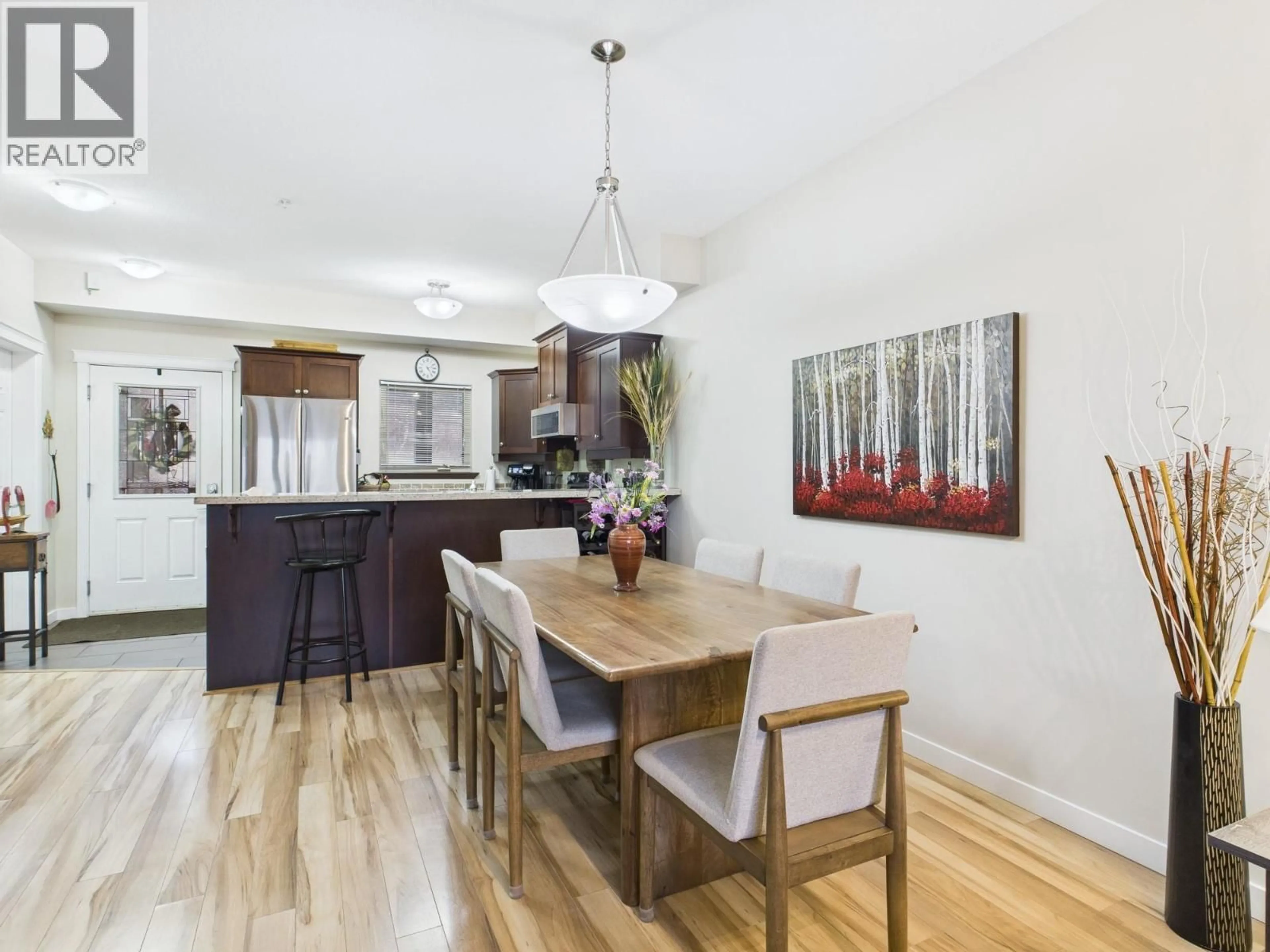 Open concept kitchen, wood/laminate floor for 114 - 4300 44TH AVENUE, Osoyoos British Columbia V0H1V6