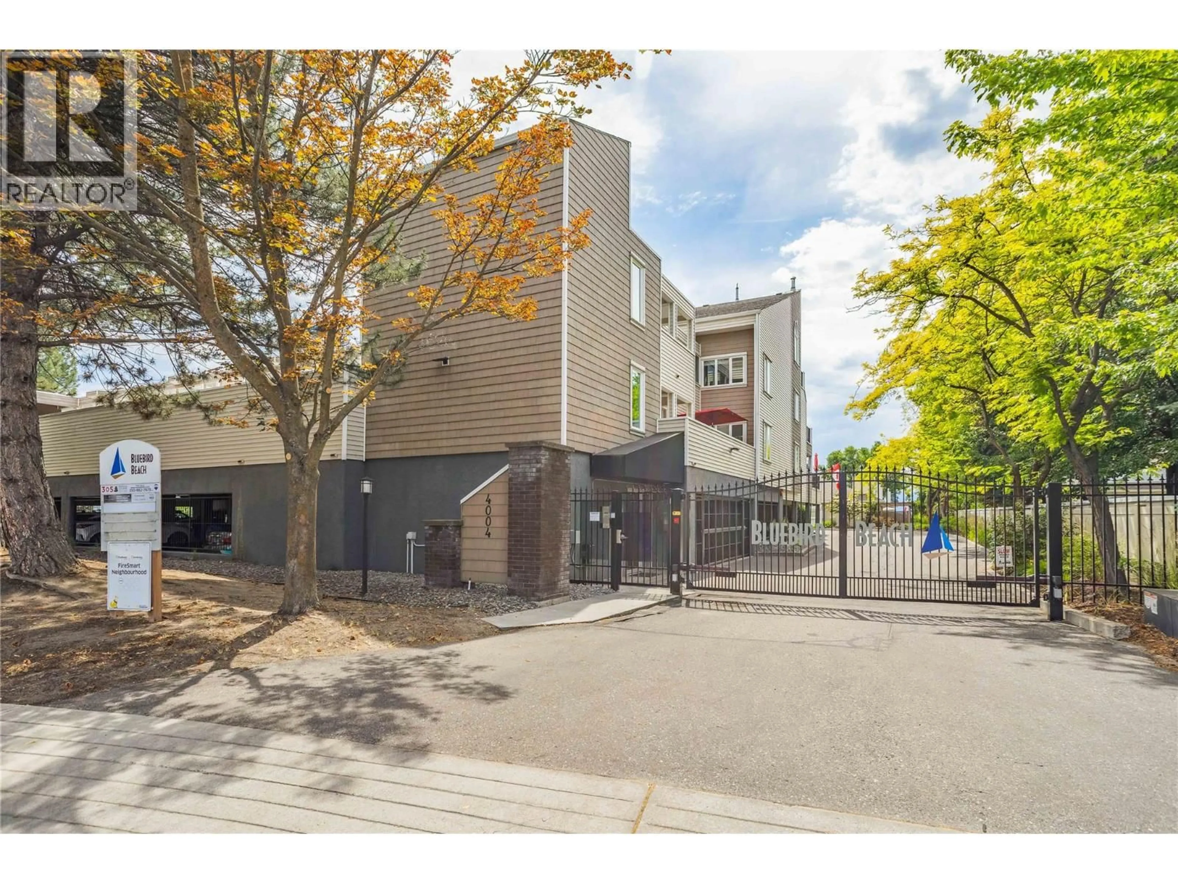 A pic from outside/outdoor area/front of a property/back of a property/a pic from drone, street for 303 - 4004 BLUEBIRD ROAD, Kelowna British Columbia V1X1X6