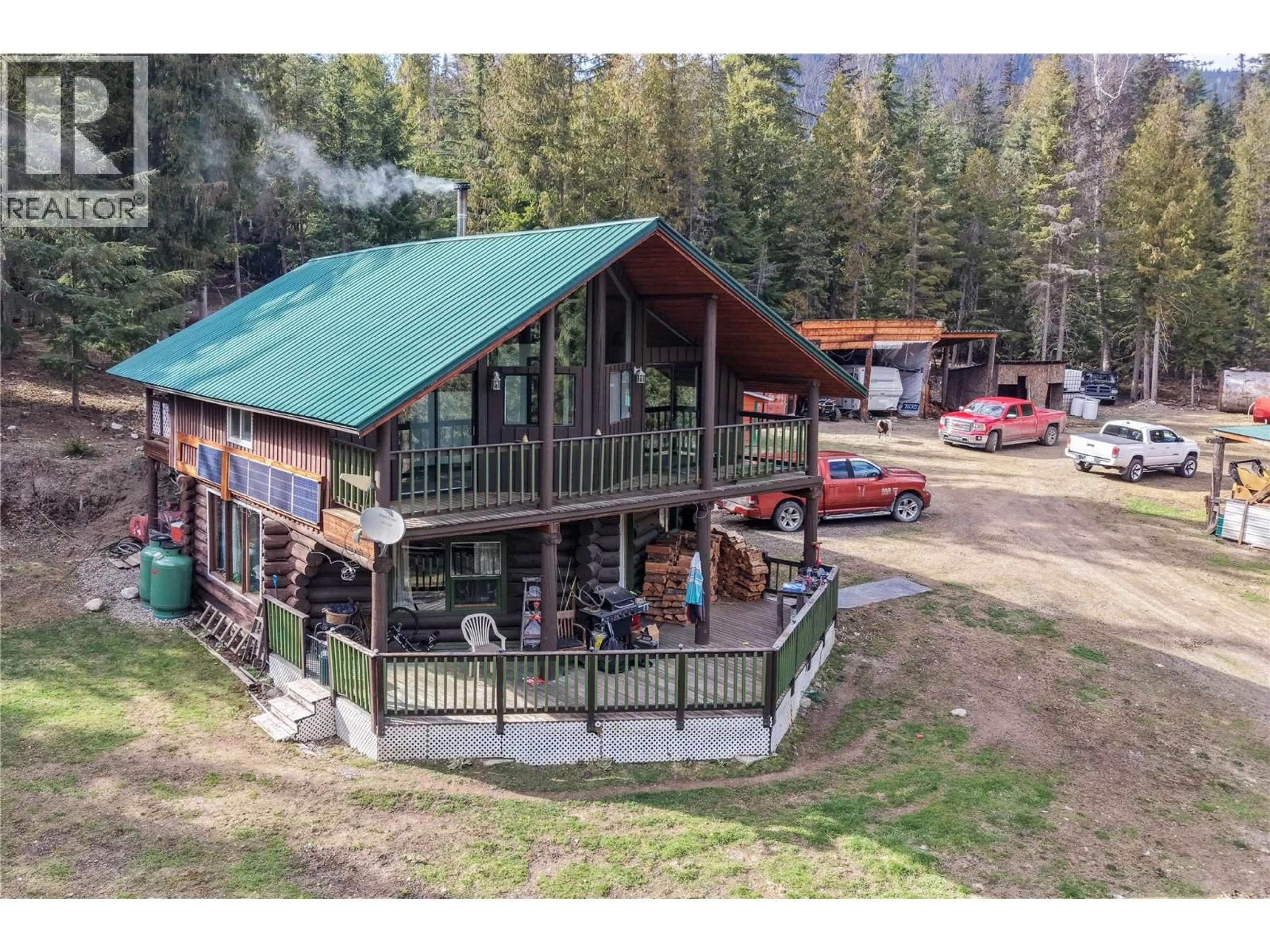 A pic from outside/outdoor area/front of a property/back of a property/a pic from drone, mountain view for 829 BOBBIE BURNS ROAD, Lumby British Columbia V0E2G4