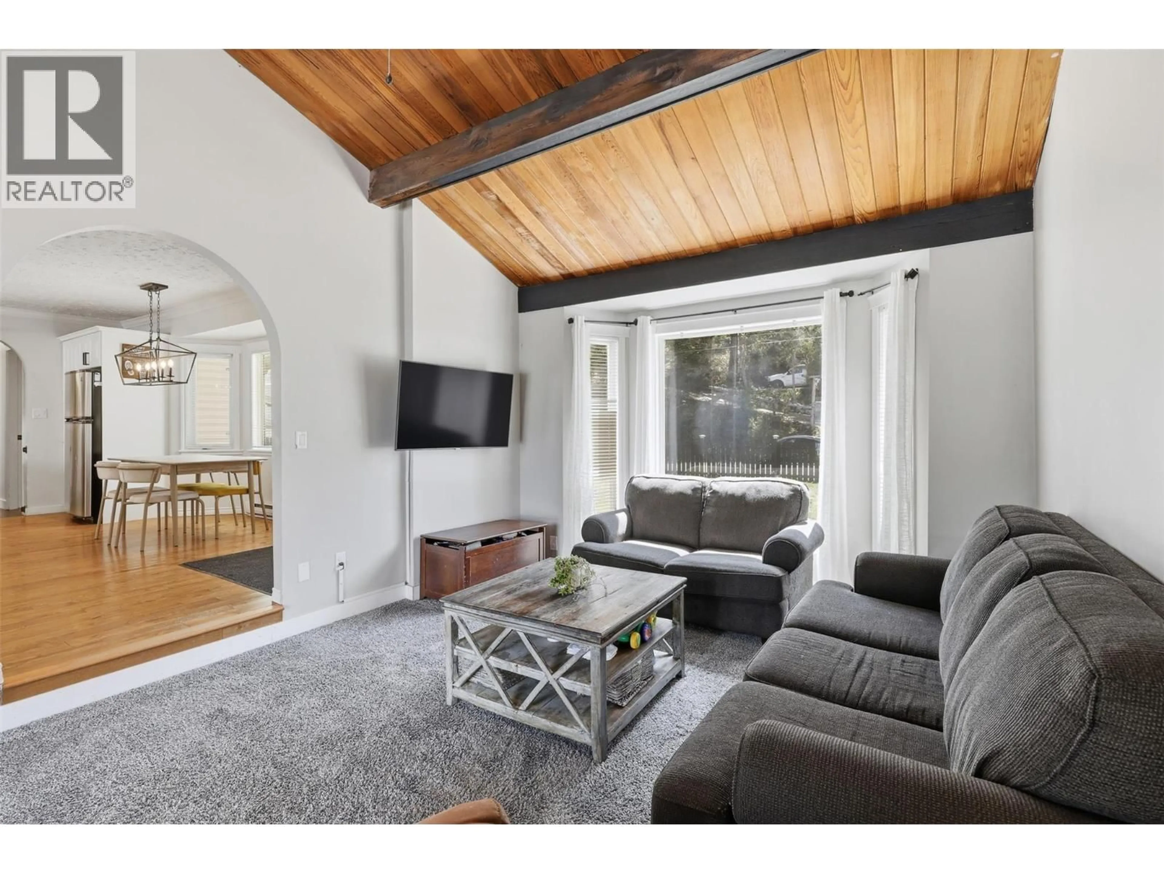 Living room with furniture, wood/laminate floor for 3365 MCGREGOR ROAD, Kamloops British Columbia V0E3E1