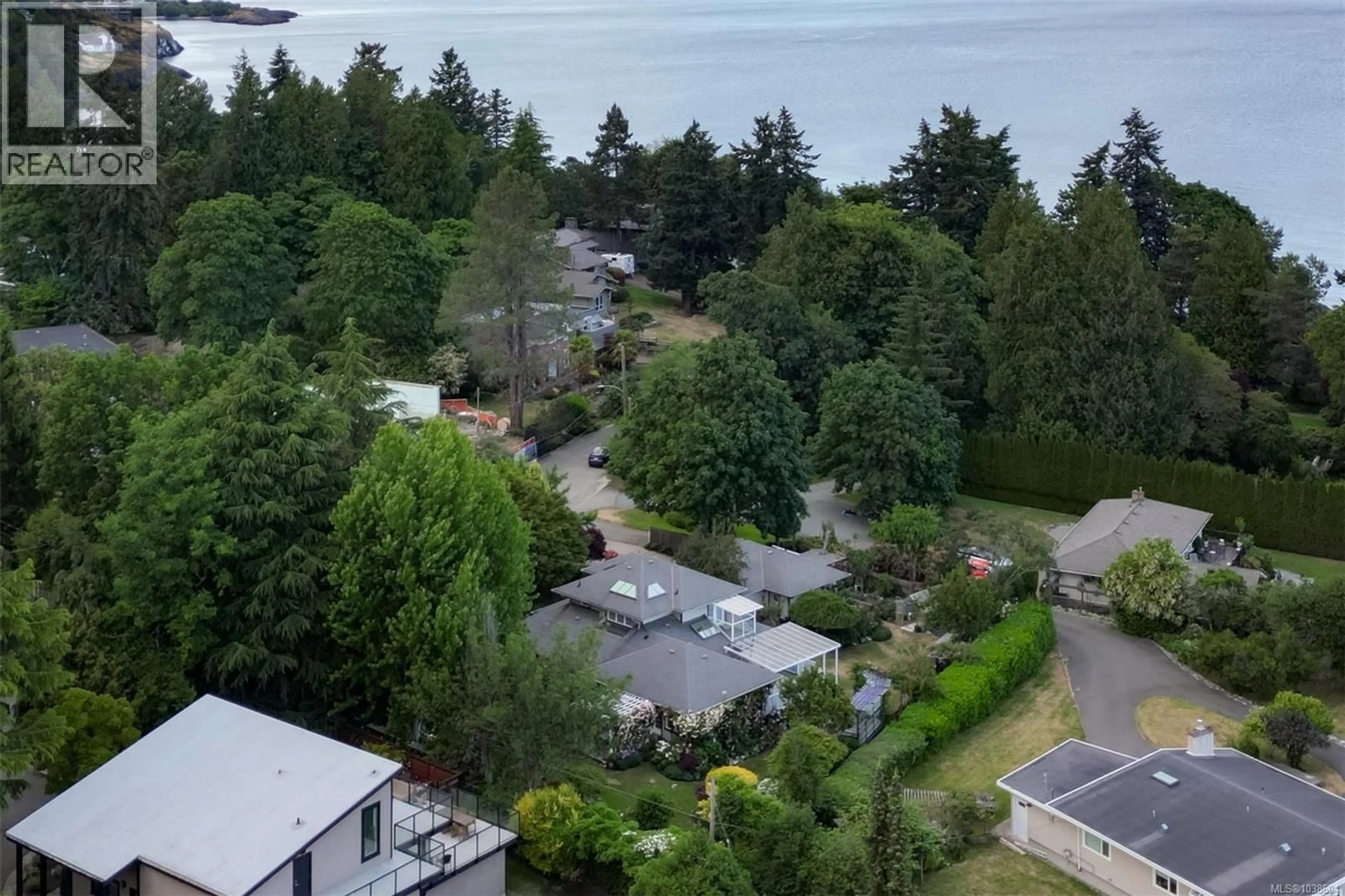 A pic from outside/outdoor area/front of a property/back of a property/a pic from drone, water/lake/river/ocean view for 4005 LOCARNO LANE, Saanich British Columbia V8N3Z9