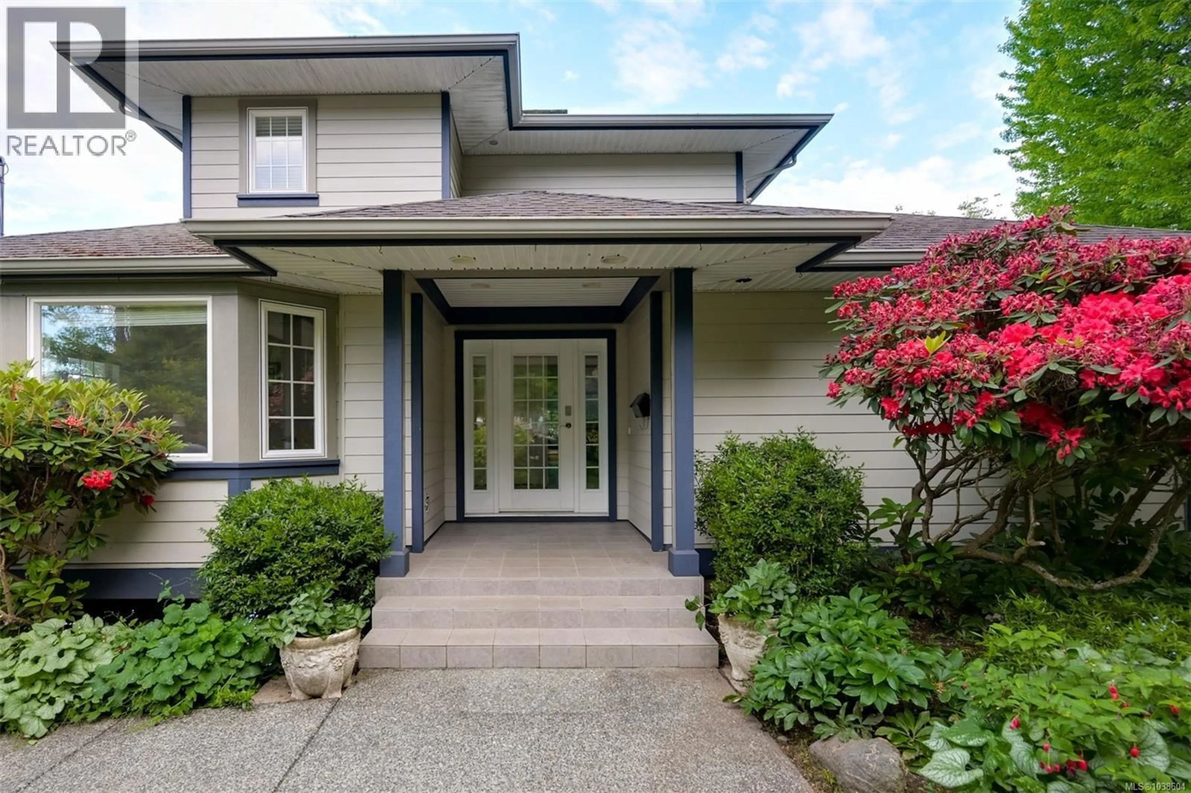 Home with vinyl exterior material, street for 4005 LOCARNO LANE, Saanich British Columbia V8N3Z9