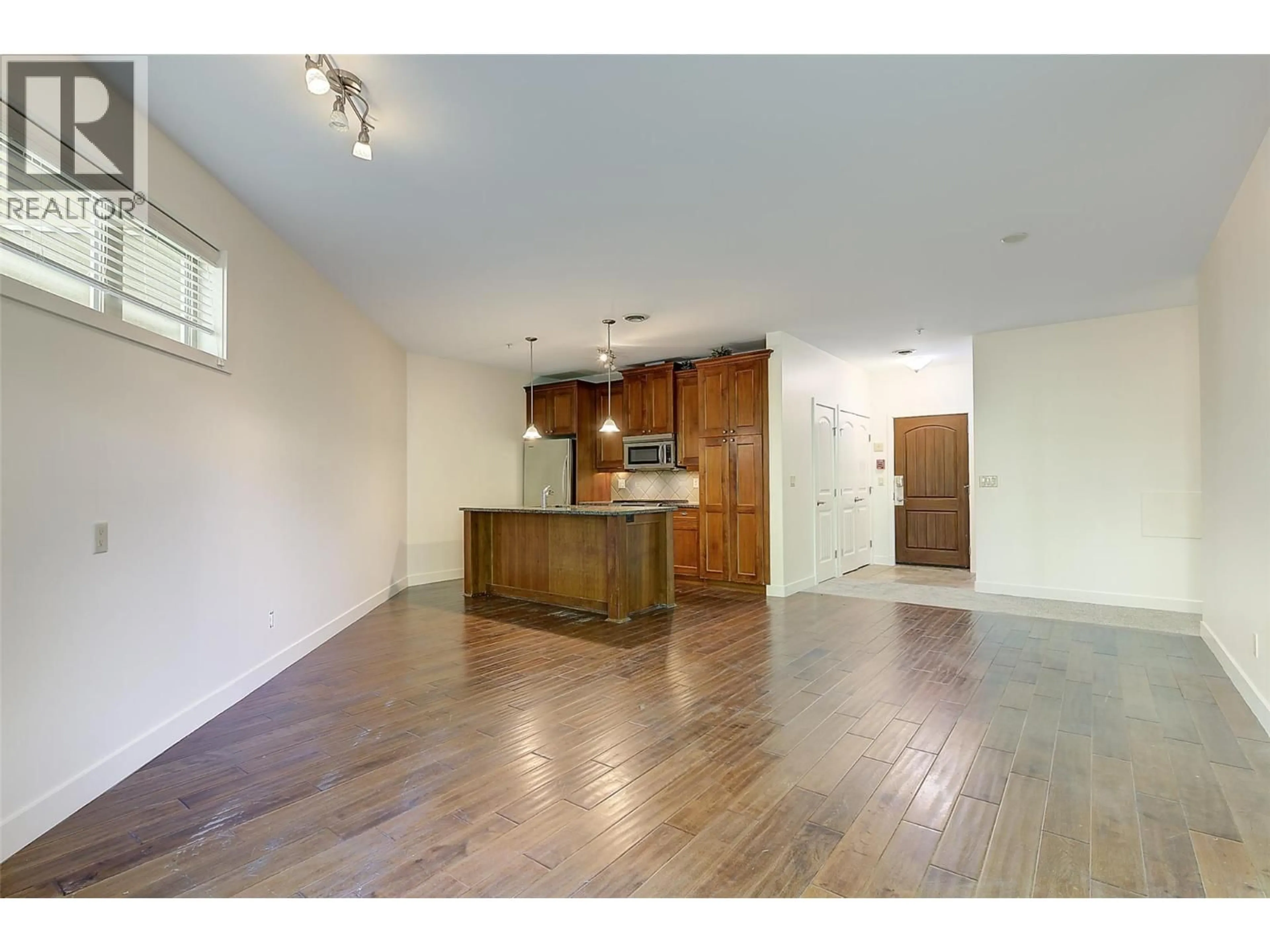 Open concept kitchen, wood/laminate floor for 2104 - 4042 PRITCHARD DRIVE, West Kelowna British Columbia V4T3E4