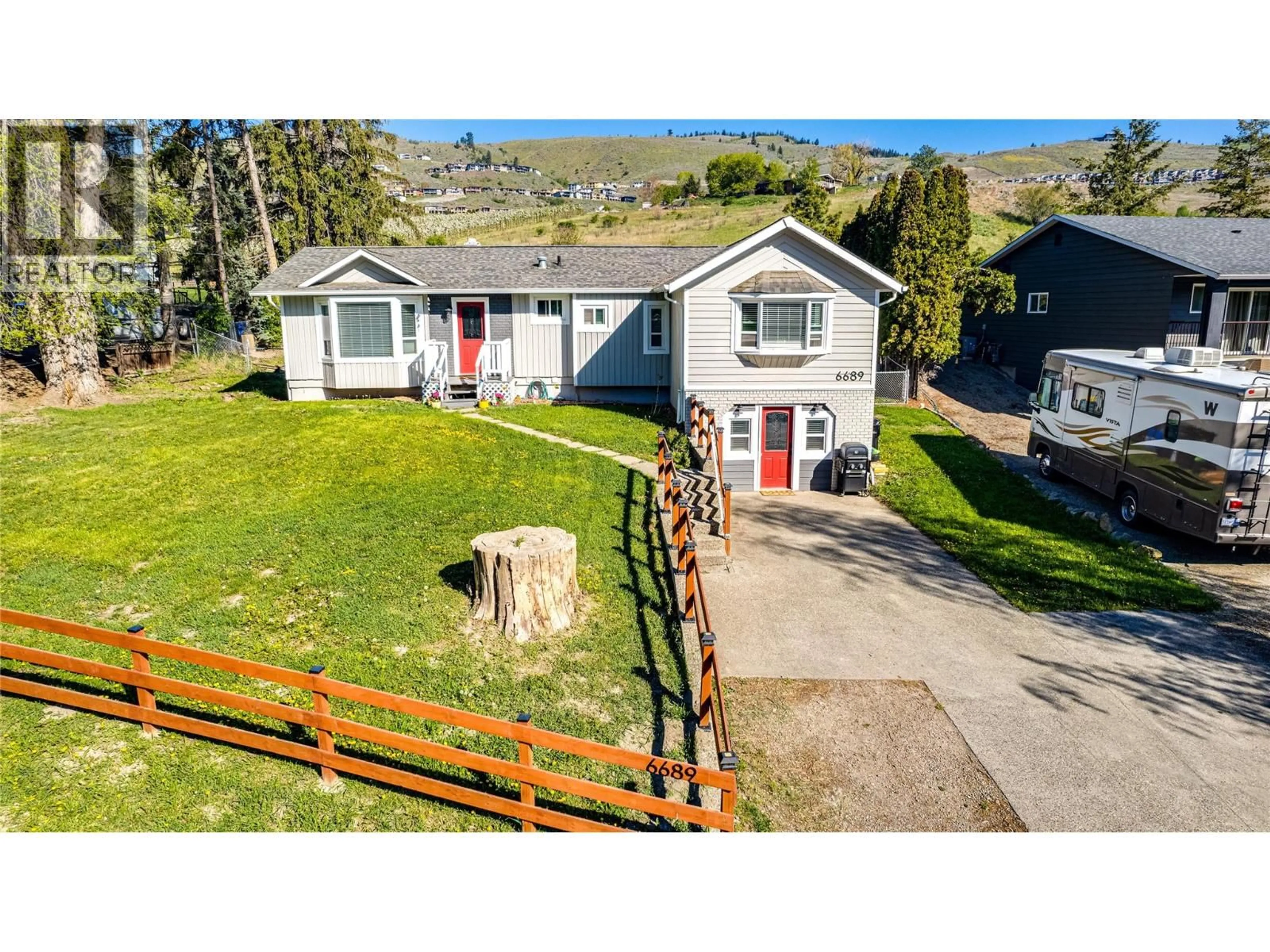 A pic from outside/outdoor area/front of a property/back of a property/a pic from drone, mountain view for 6689 CAMEO DRIVE, Vernon British Columbia V1H1N8
