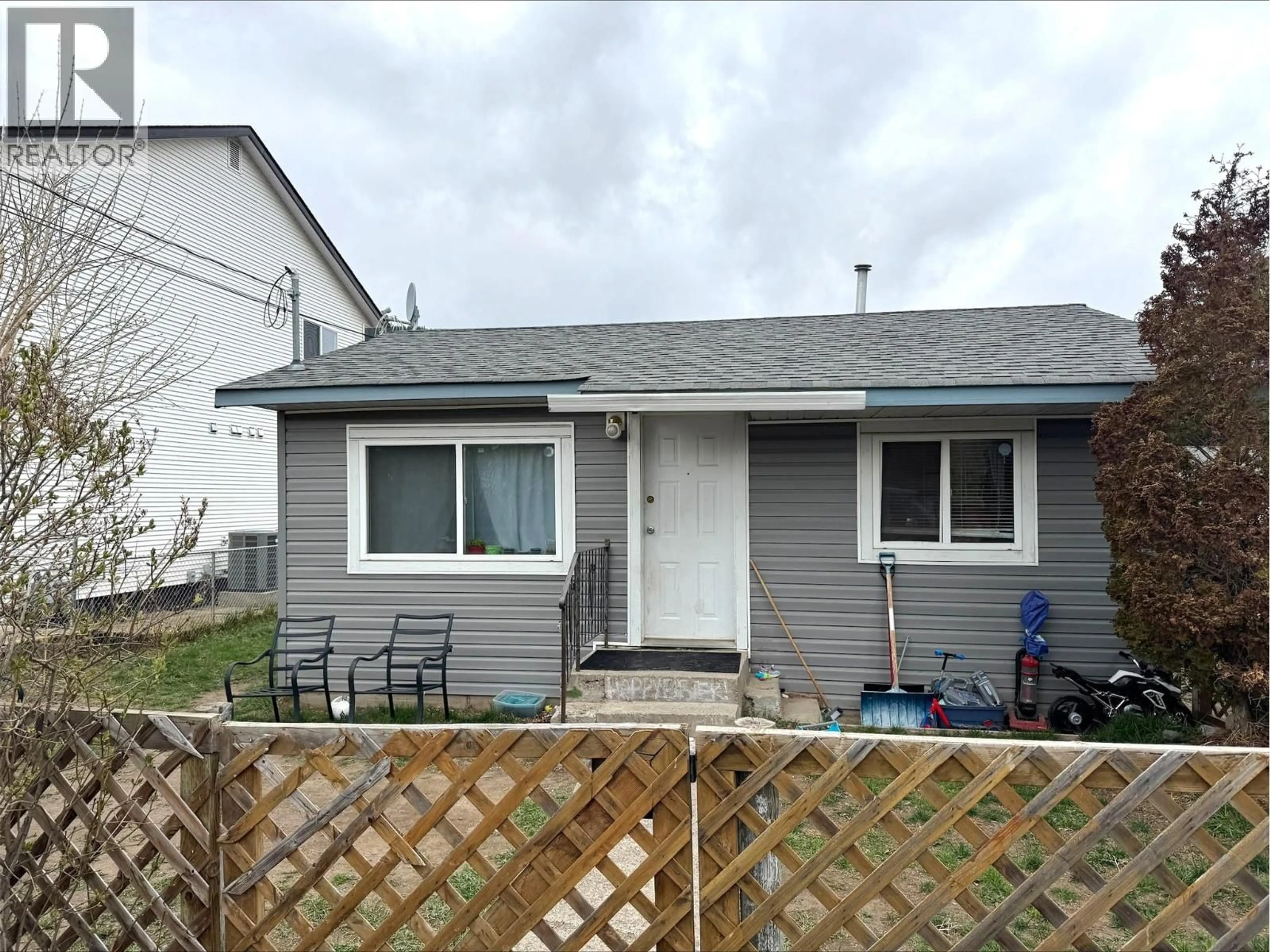 Home with vinyl exterior material, street for 1419 PINE STREET, Merritt British Columbia V1K1K5