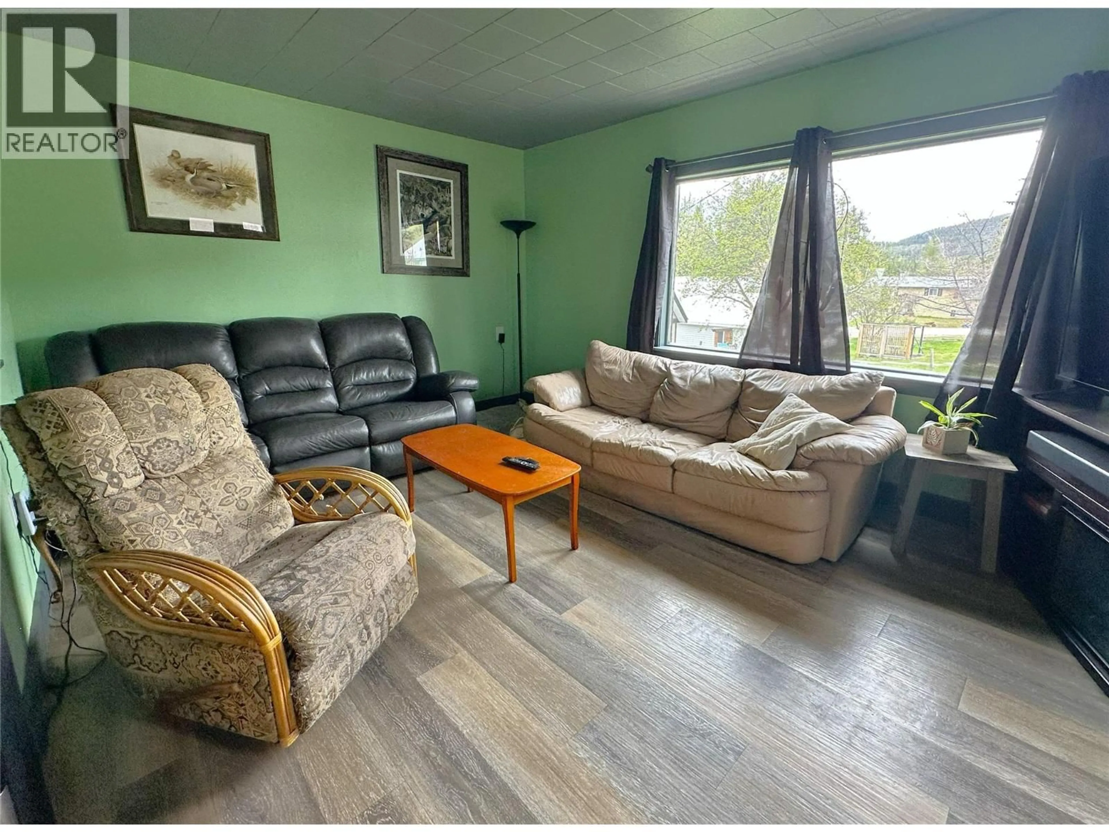 Living room with furniture, wood/laminate floor for 230 CRANBROOK STREET, Kimberley British Columbia V1A2P1