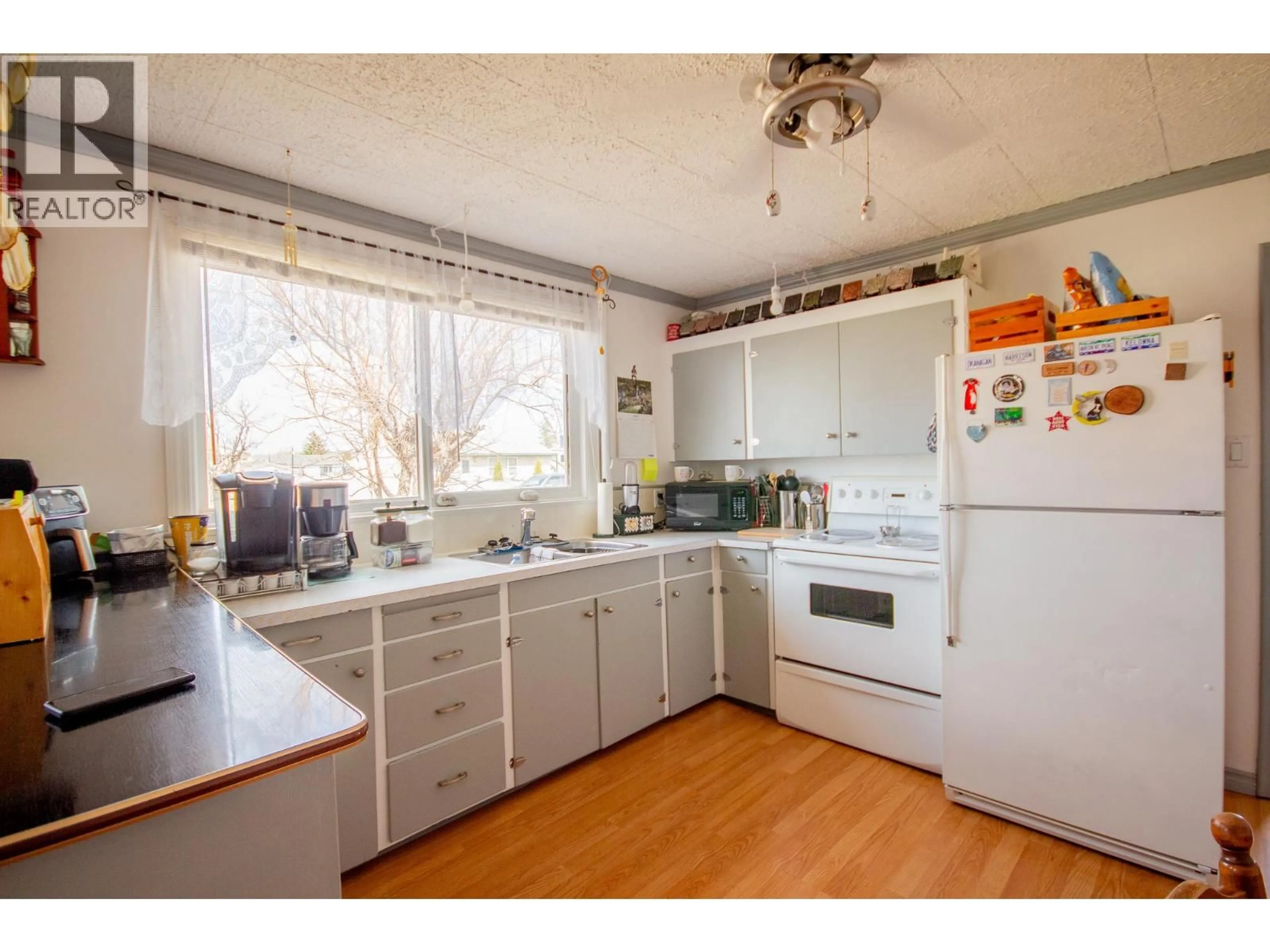 Standard kitchen, wood/laminate floor for 1217 115 AVENUE, Dawson Creek British Columbia V1G3C2