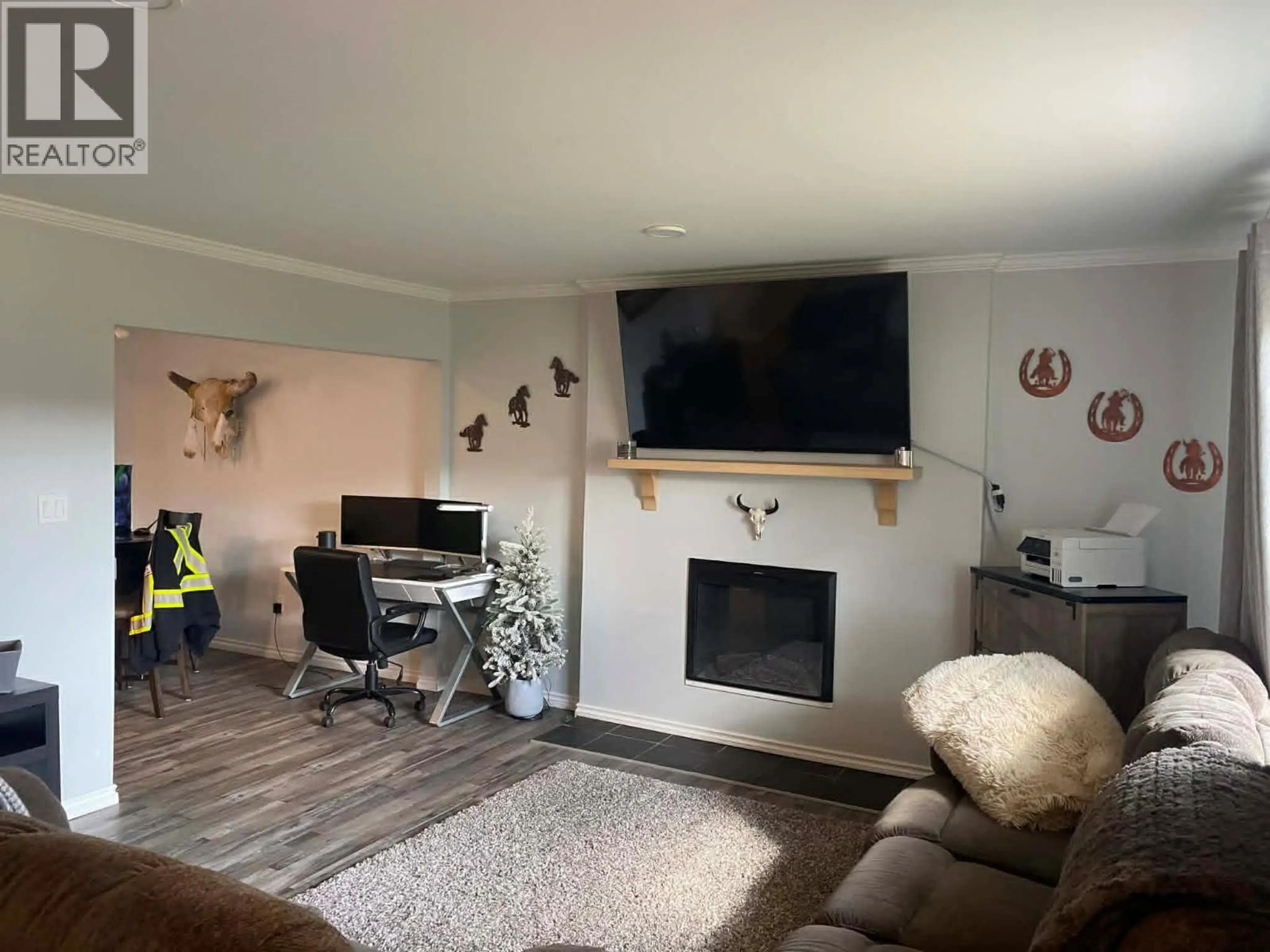 Living room with furniture, wood/laminate floor for 4616 50 AVENUE, Chetwynd British Columbia V0C1J0
