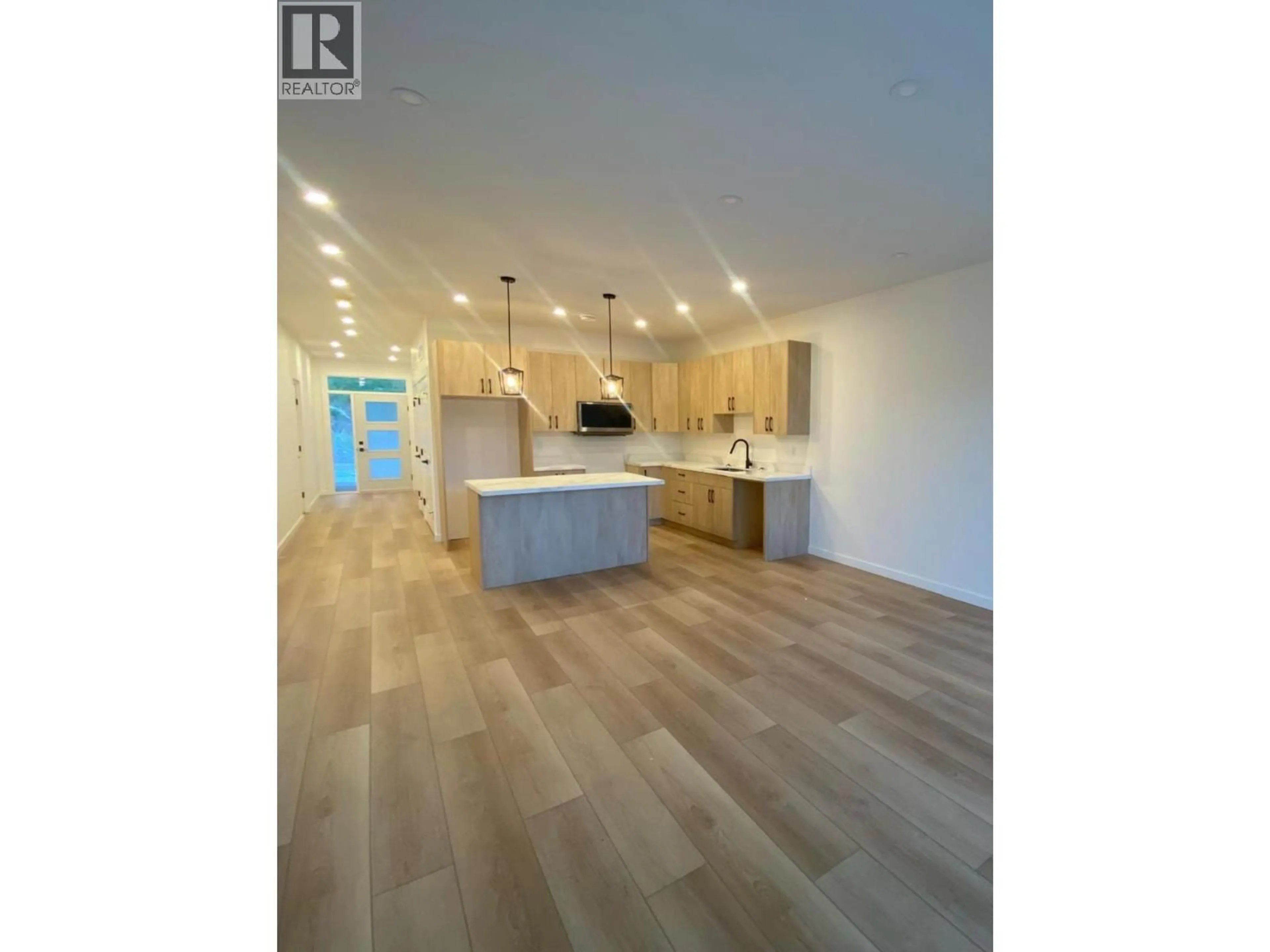Open concept kitchen, wood/laminate floor for 2982 SCENIC RIDGE DRIVE, West Kelowna British Columbia V4T1Y3