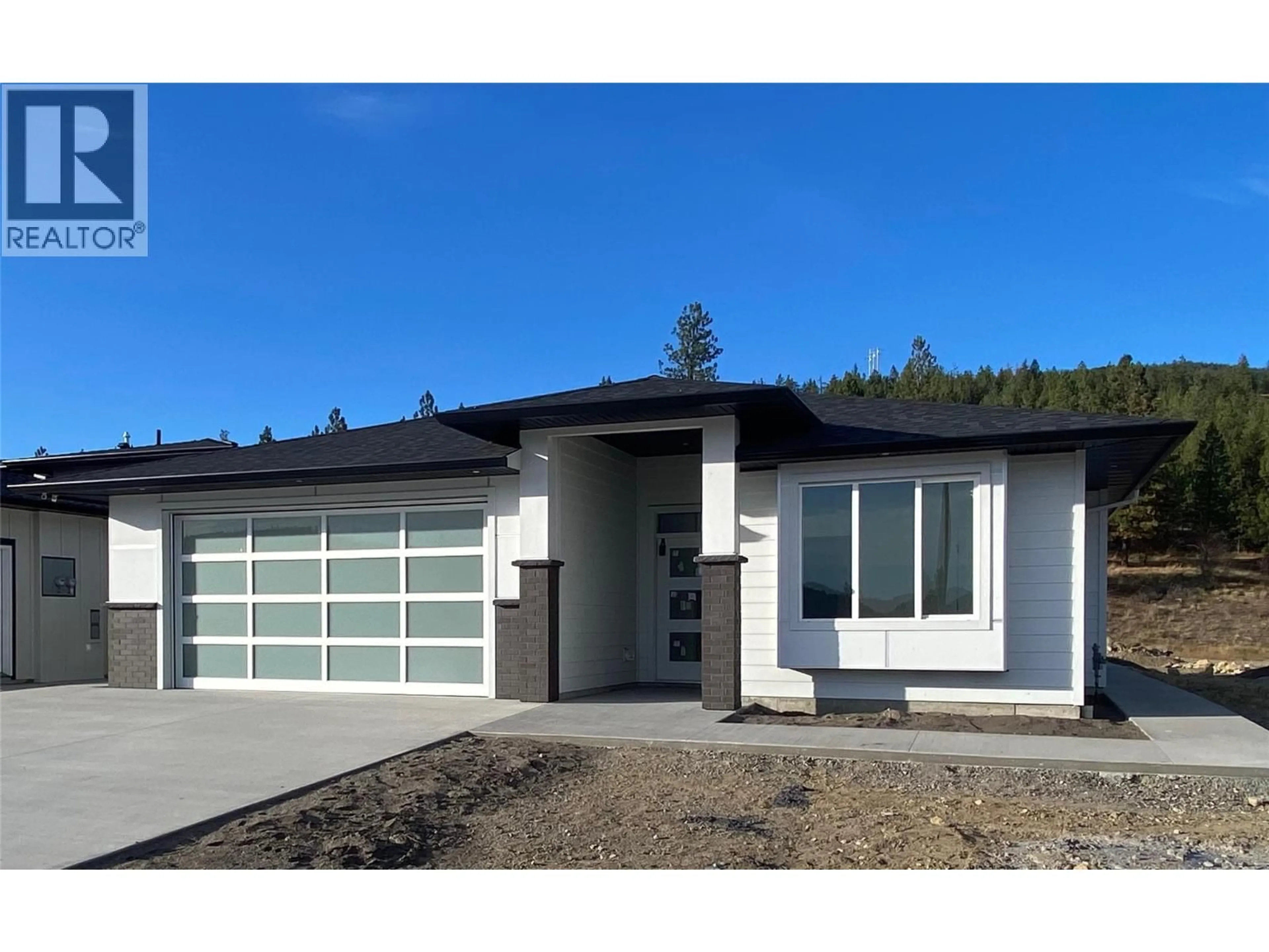 Home with vinyl exterior material, street for 2982 SCENIC RIDGE DRIVE, West Kelowna British Columbia V4T1Y3