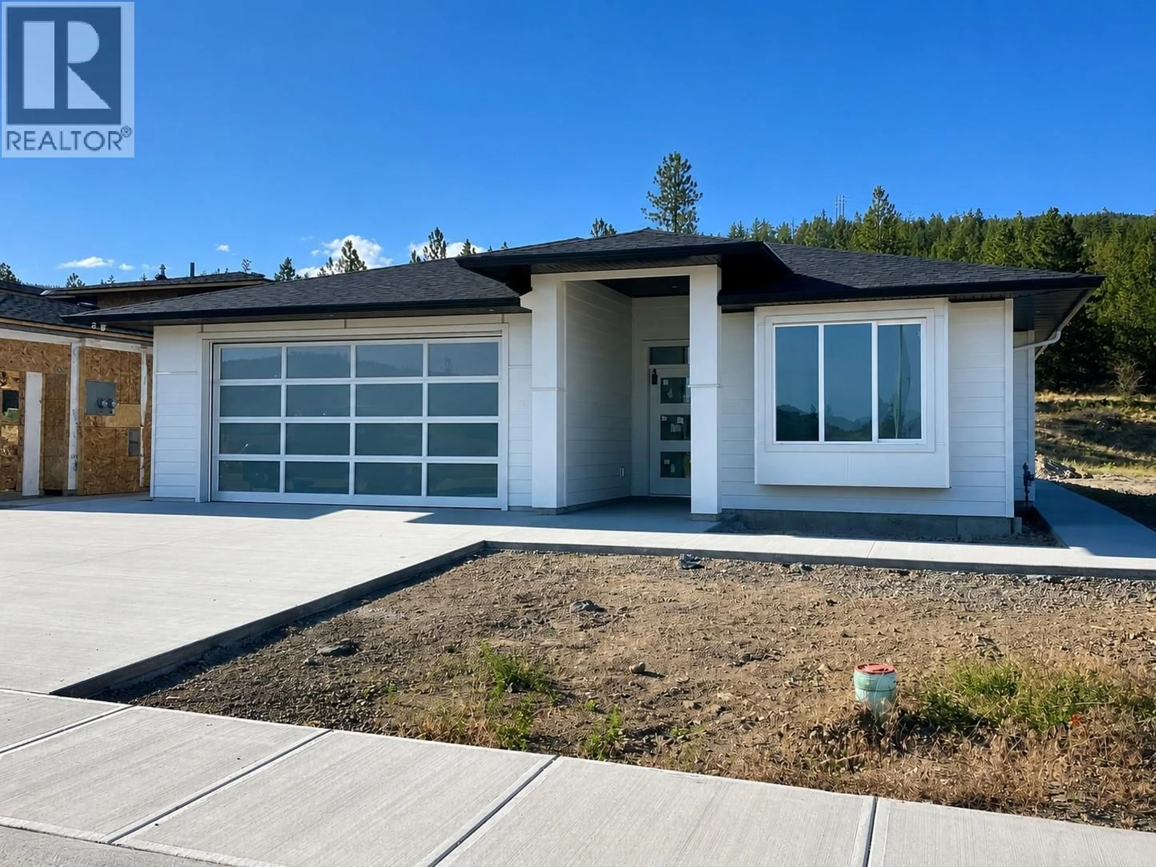 Home with vinyl exterior material, street for 2982 SCENIC RIDGE DRIVE, West Kelowna British Columbia V4T1Y3