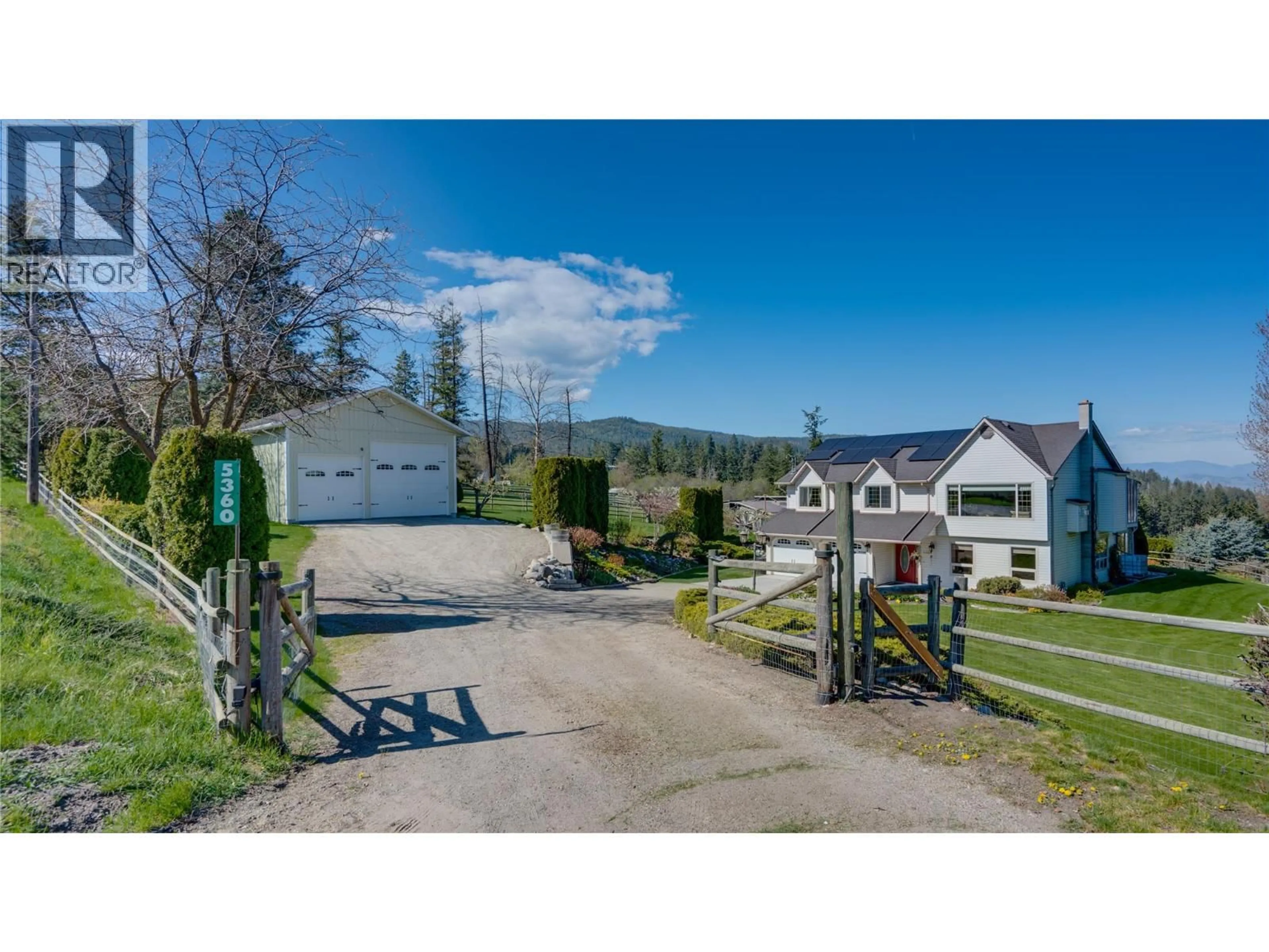 A pic from outside/outdoor area/front of a property/back of a property/a pic from drone, street for 5360 LEARMOUTH ROAD, Coldstream British Columbia V1B3E8