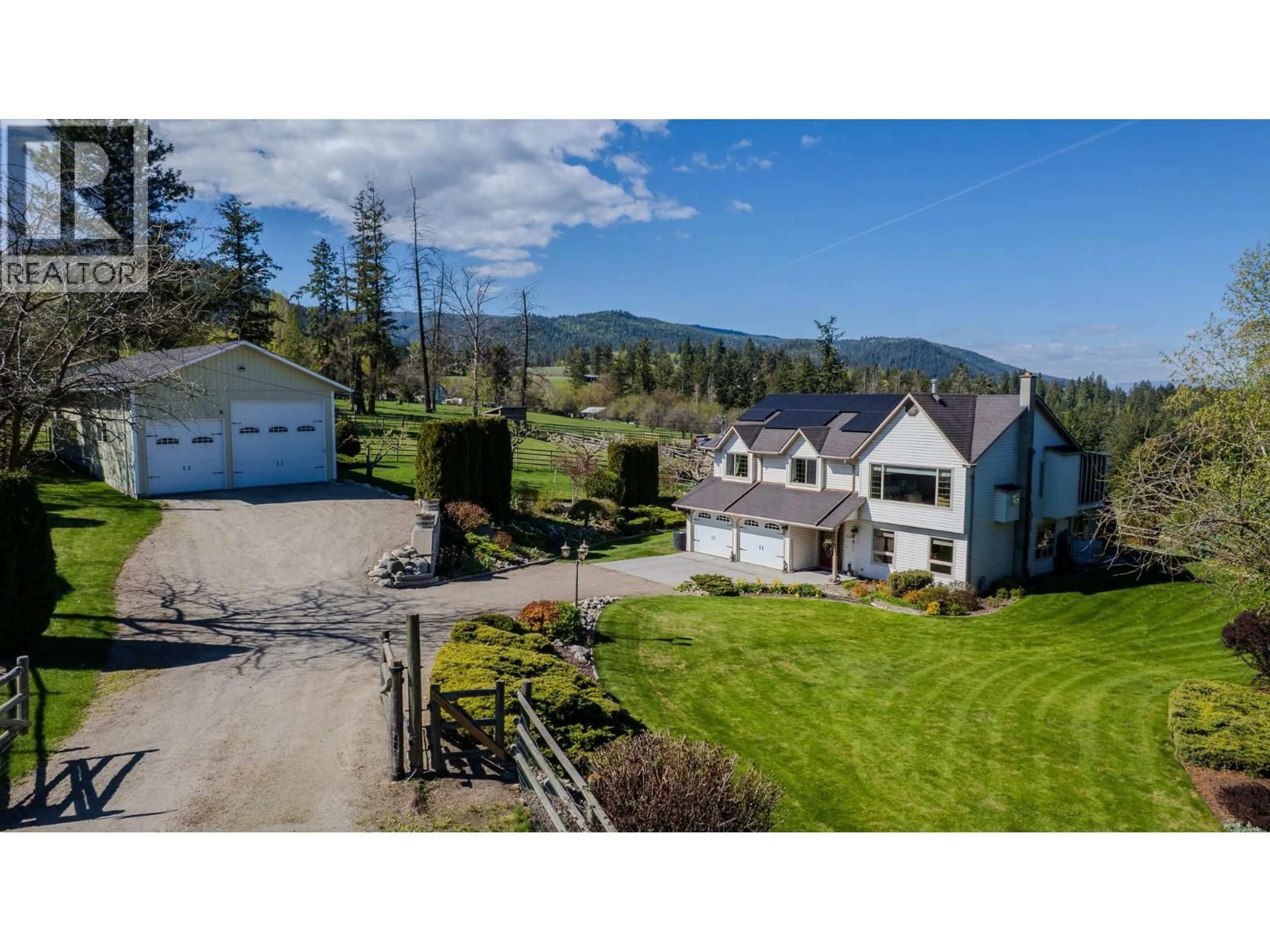 A pic from outside/outdoor area/front of a property/back of a property/a pic from drone, mountain view for 5360 LEARMOUTH ROAD, Coldstream British Columbia V1B3E8
