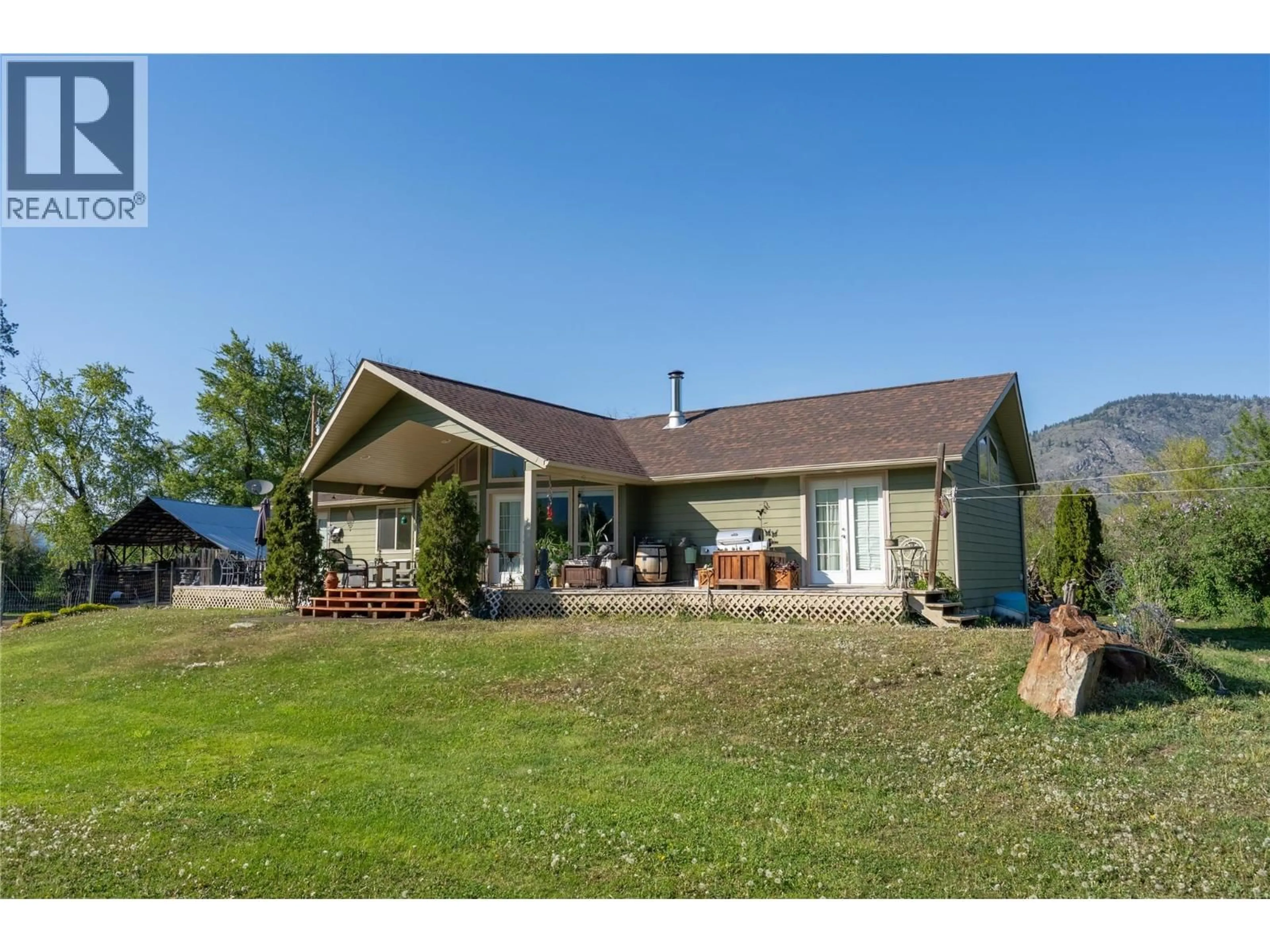 A pic from outside/outdoor area/front of a property/back of a property/a pic from drone, water/lake/river/ocean view for 299 ANTIFAEV ROAD, Grand Forks British Columbia V0H1H9