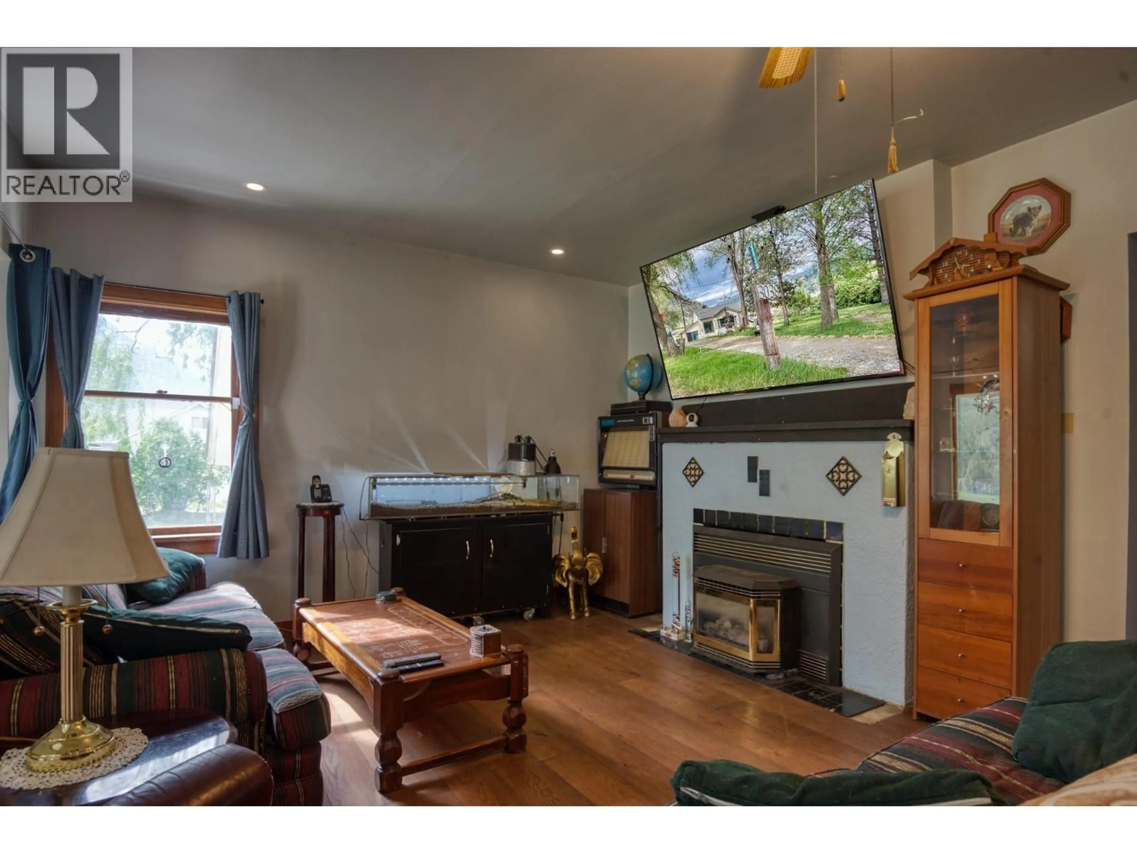 Living room with furniture, wood/laminate floor for 3038 10TH AVENUE, Keremeos British Columbia V0X1N3