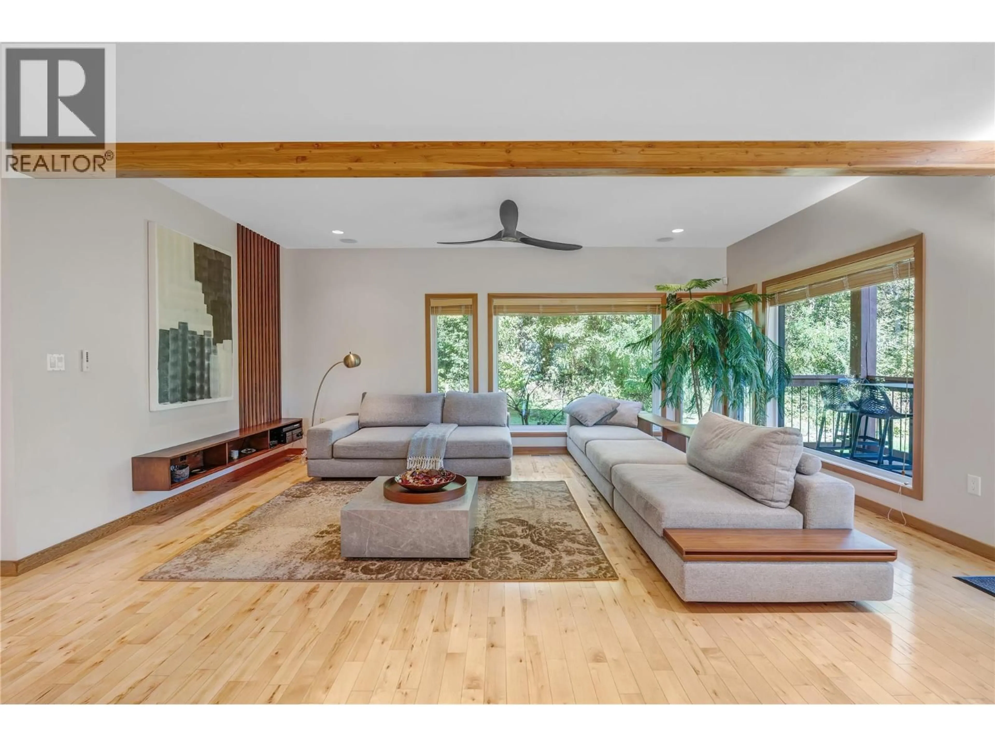 Living room with furniture, wood/laminate floor for 1702 THORNBER STREET, Summerland British Columbia V0H1Z9