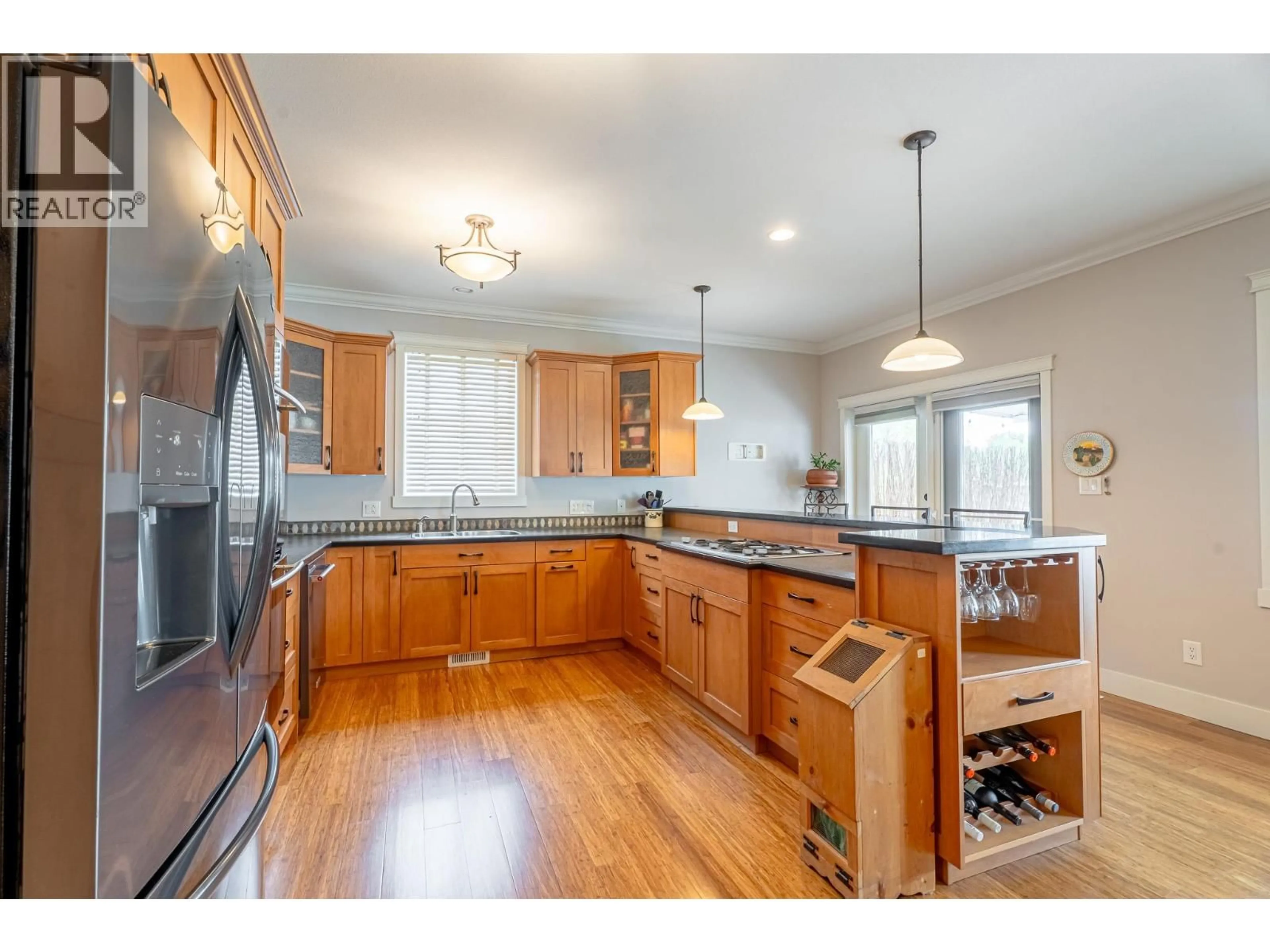 Open concept kitchen, wood/laminate floor for 545 KOBAYASHI PLACE, Kamloops British Columbia V2B0B5
