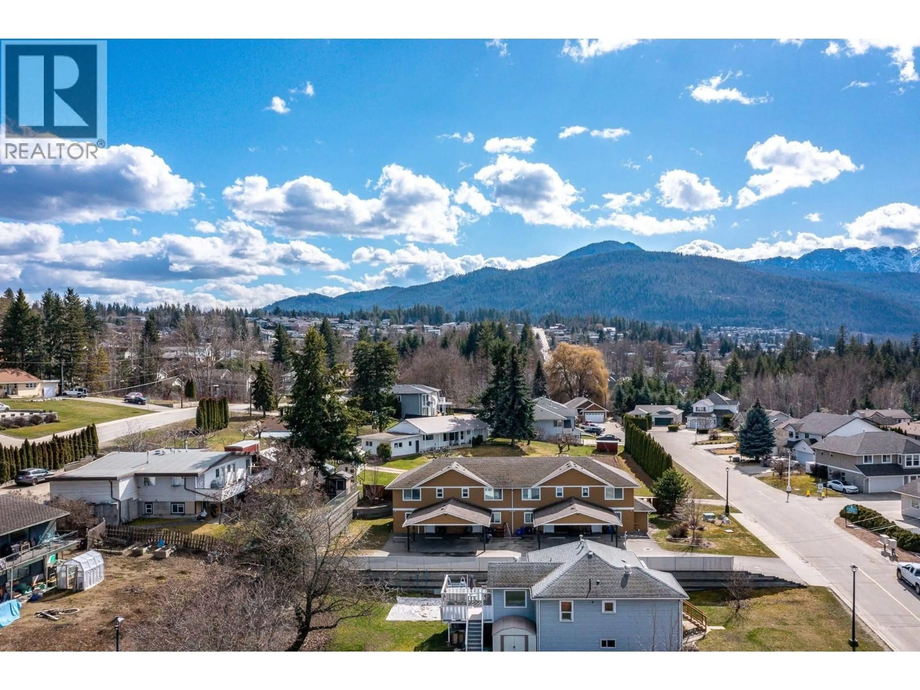 A pic from outside/outdoor area/front of a property/back of a property/a pic from drone, mountain view for 1-4 - 780 20 STREET NORTHEAST, Salmon Arm British Columbia V1E2K9