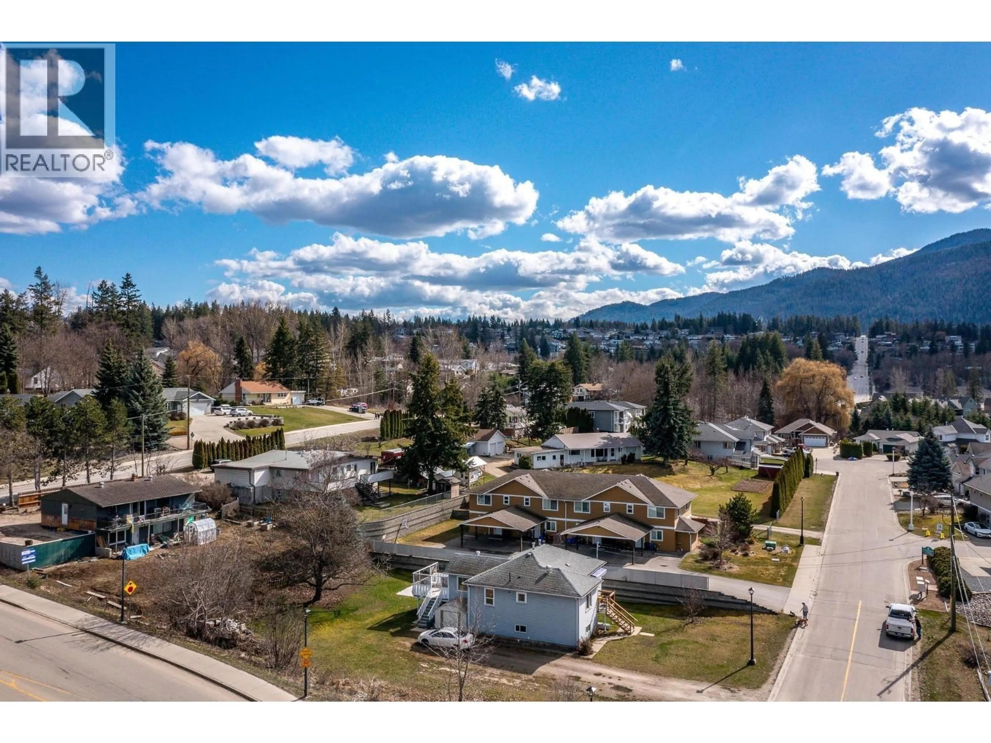 A pic from outside/outdoor area/front of a property/back of a property/a pic from drone, mountain view for 1-4 - 780 20 STREET NORTHEAST, Salmon Arm British Columbia V1E2K9