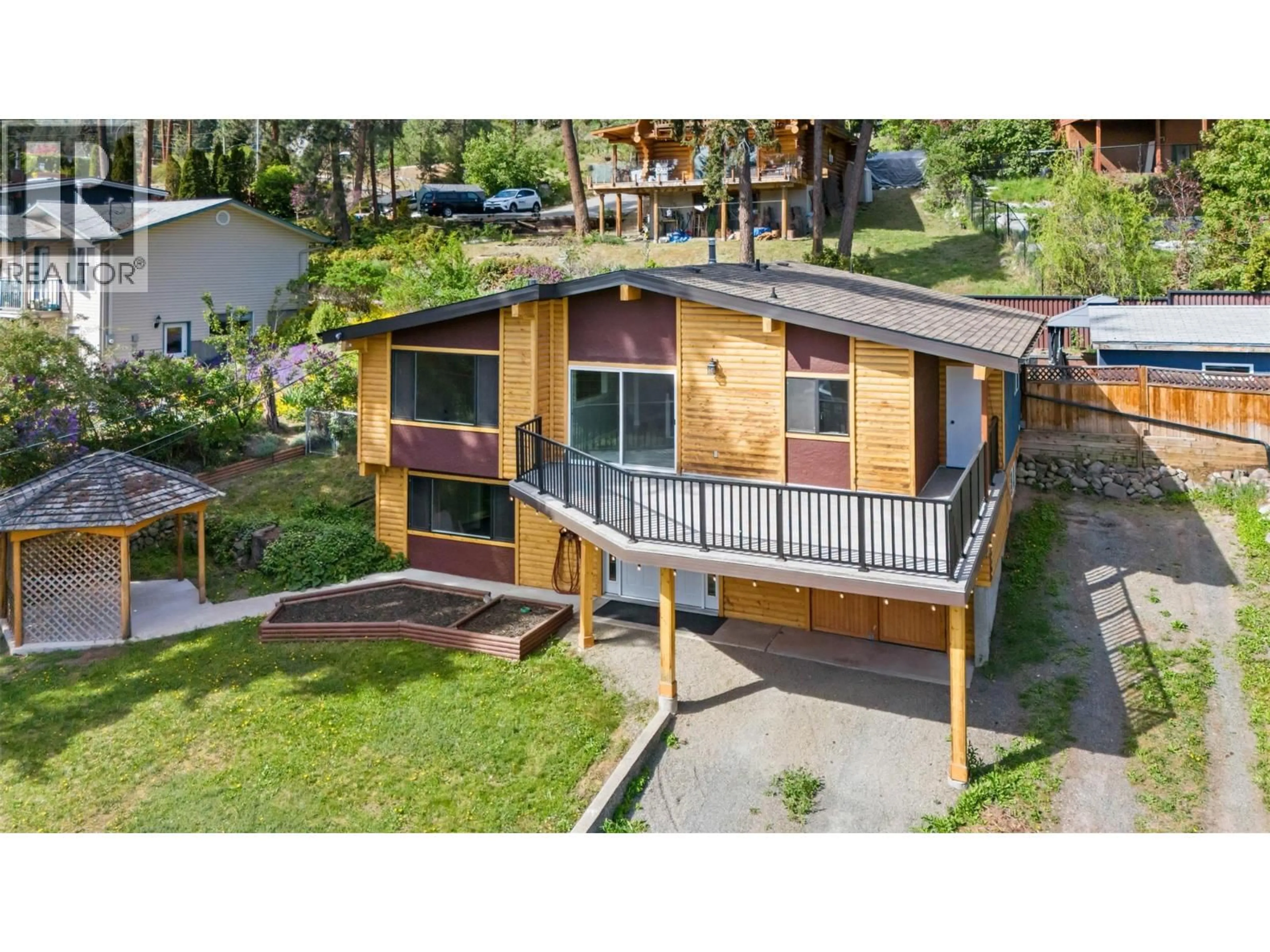 A pic from outside/outdoor area/front of a property/back of a property/a pic from drone, street for 3492 MCTAGGART ROAD, West Kelowna British Columbia V4T1H5
