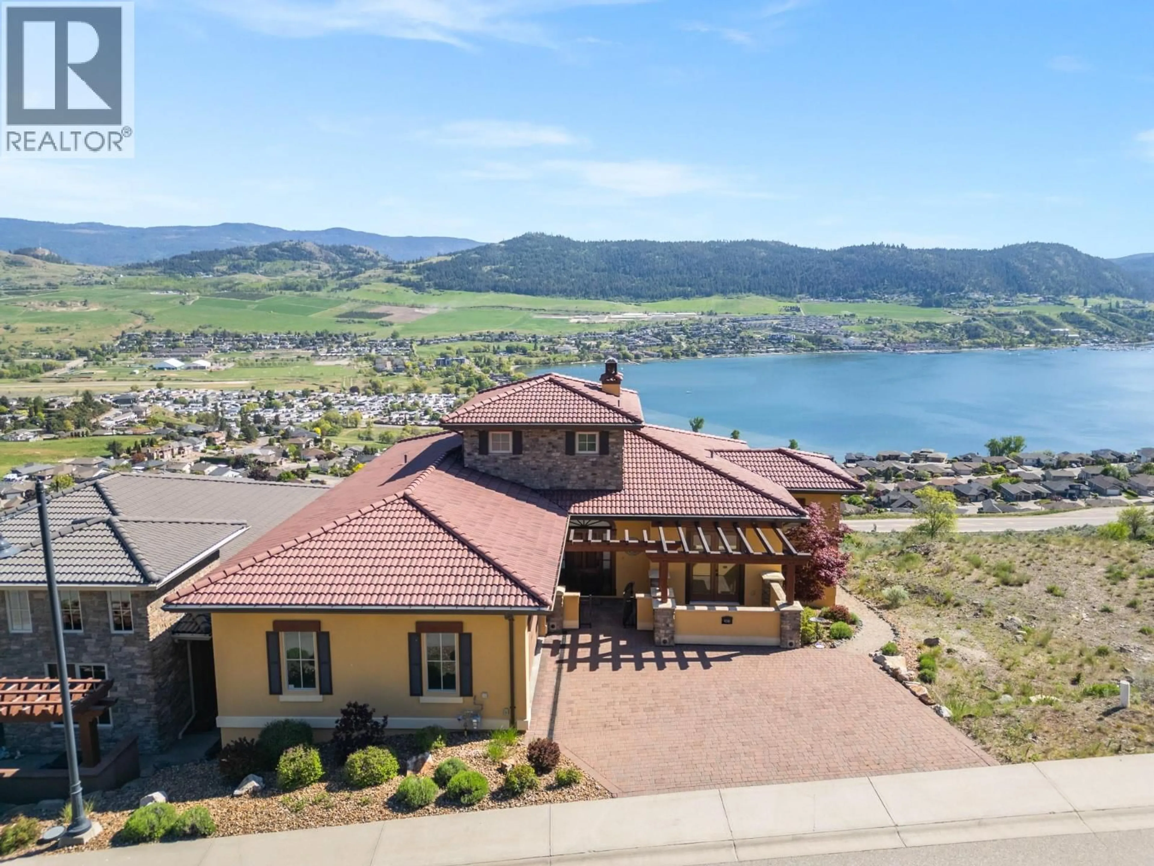 A pic from outside/outdoor area/front of a property/back of a property/a pic from drone, water/lake/river/ocean view for 108 VINEYARD WAY, Vernon British Columbia V1H1Z7