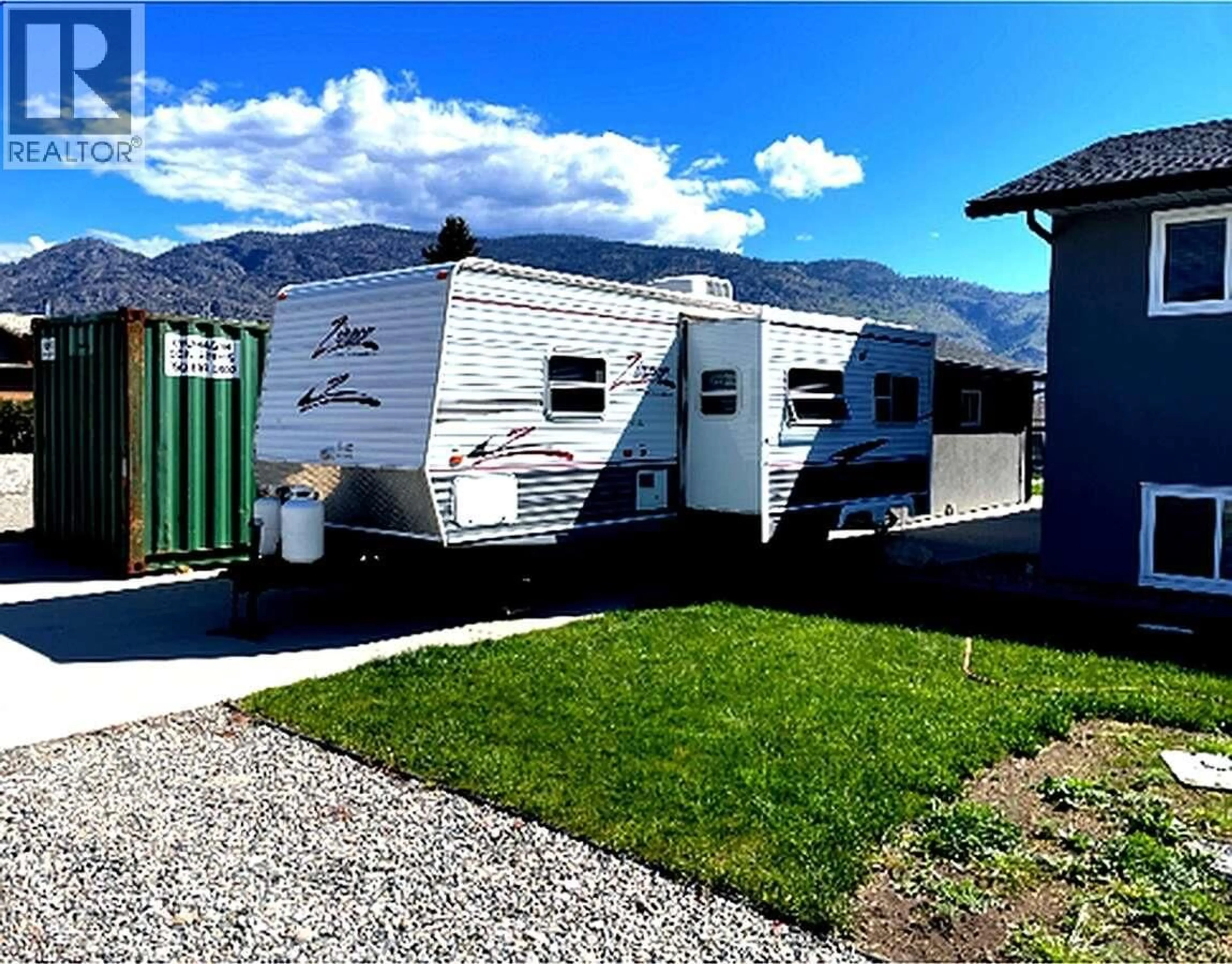 Home with vinyl exterior material, mountain view for 9106 HUMMINGBIRD LANE, Osoyoos British Columbia V0H1V5