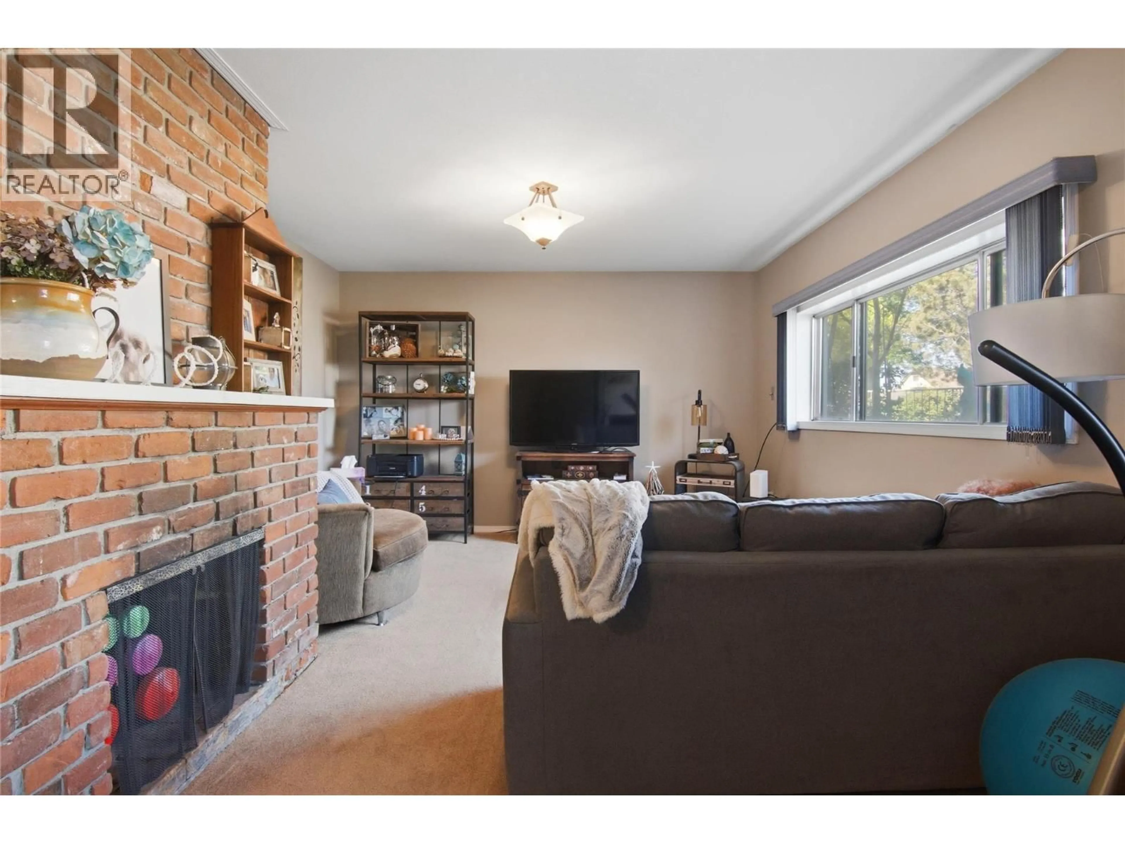 Living room with furniture, wood/laminate floor for 236 SPRUCE AVENUE, Kamloops British Columbia V2B1J1