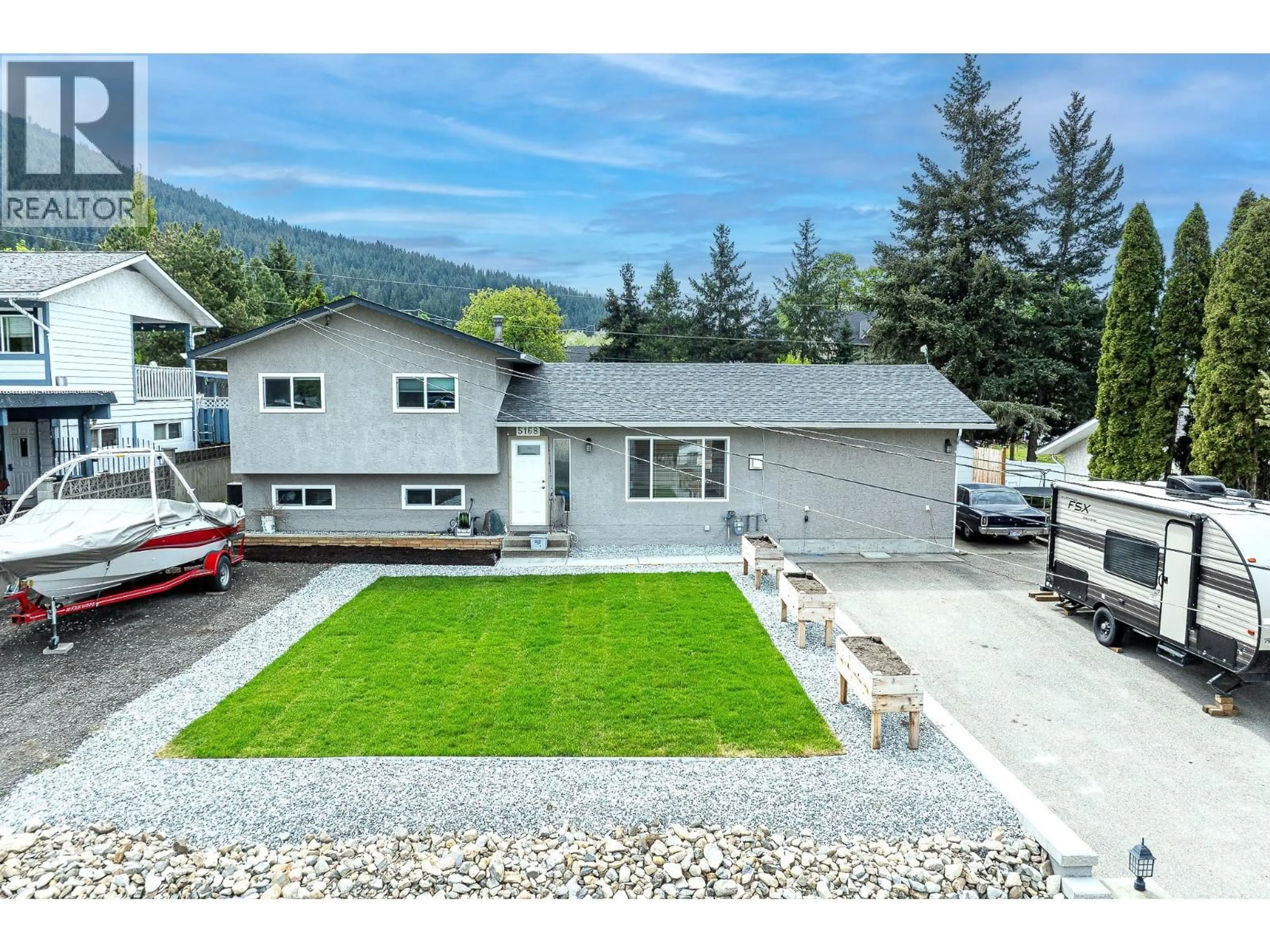 A pic from outside/outdoor area/front of a property/back of a property/a pic from drone, mountain view for 5168 HAYNES ROAD, Vernon British Columbia V1B3J6