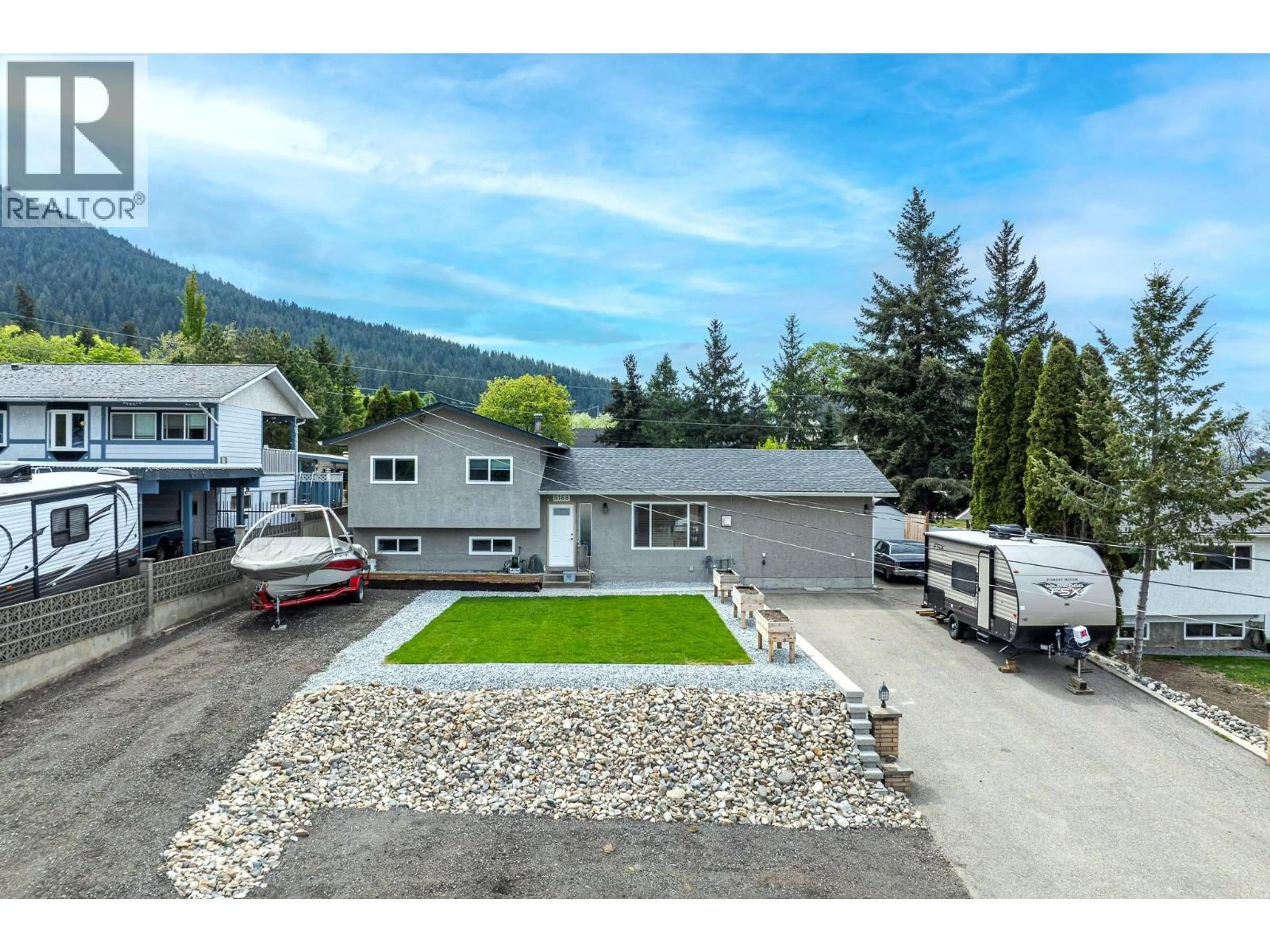 A pic from outside/outdoor area/front of a property/back of a property/a pic from drone, mountain view for 5168 HAYNES ROAD, Vernon British Columbia V1B3J6