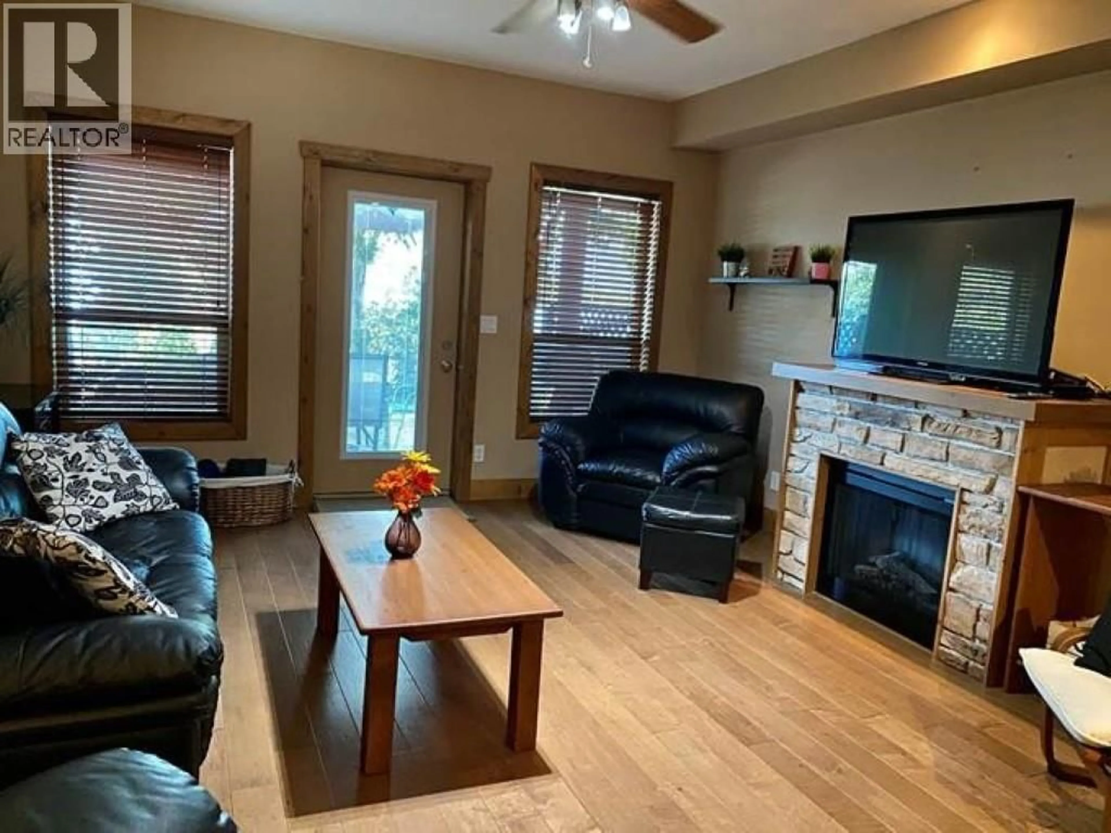 Living room with furniture, wood/laminate floor for 120 - 5401 LAKESHORE DRIVE, Osoyoos British Columbia V0H1V6