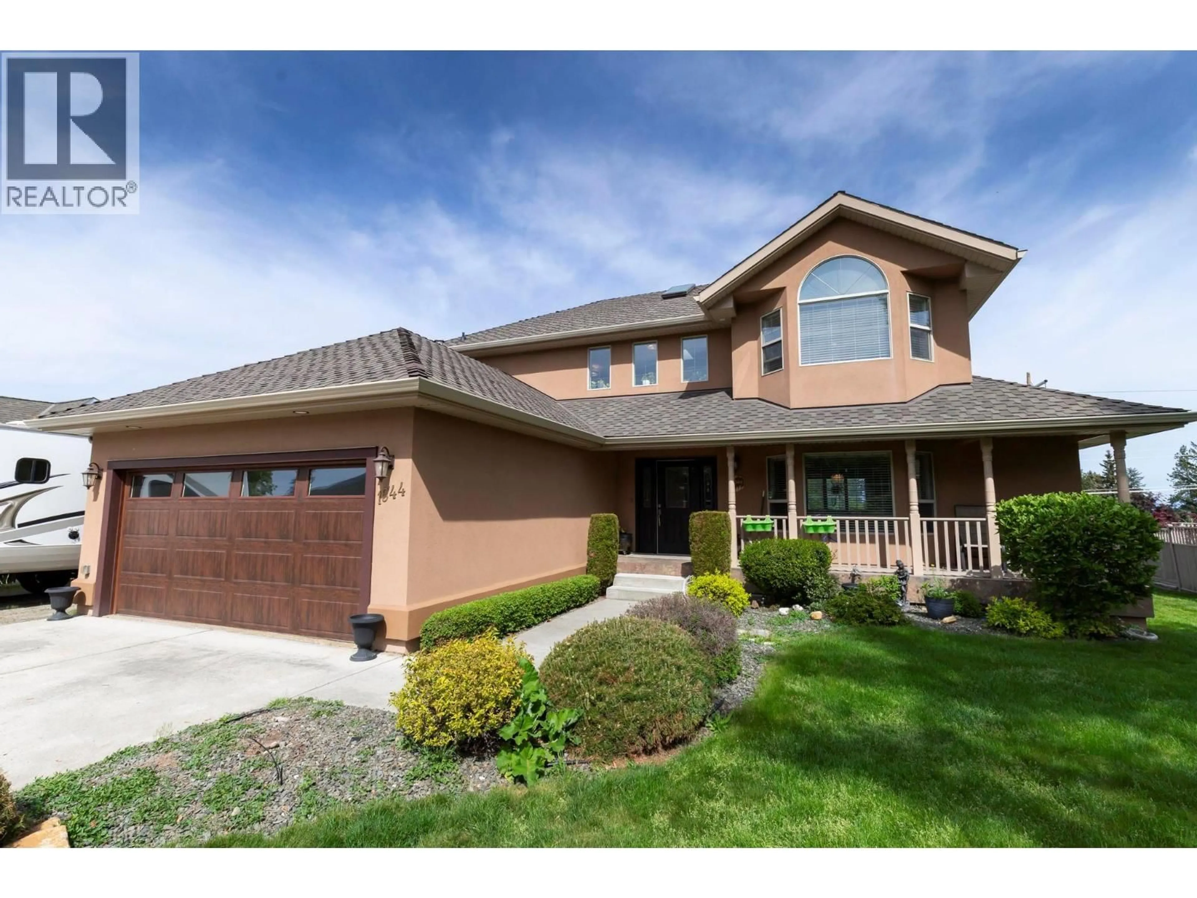 Home with brick exterior material, street for 1544 WOODRIDGE ROAD, Kelowna British Columbia V1W2Z9