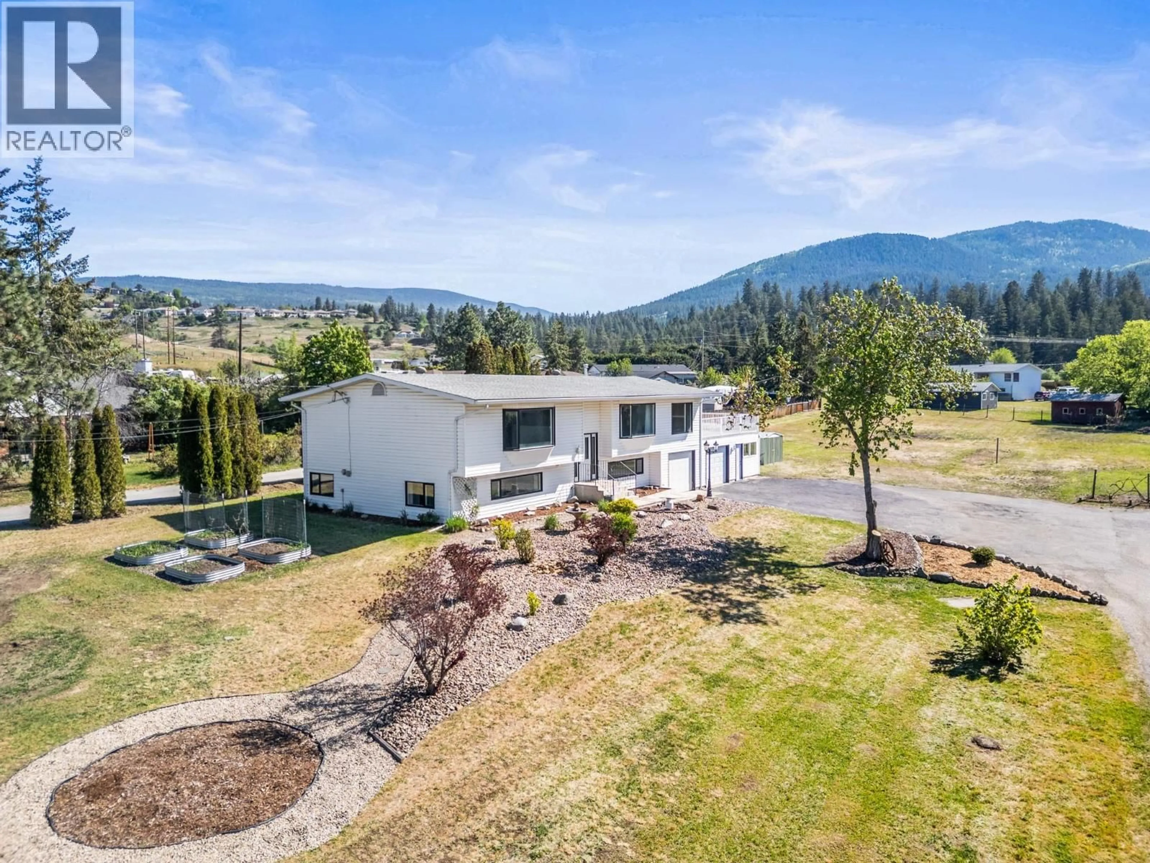A pic from outside/outdoor area/front of a property/back of a property/a pic from drone, mountain view for 6109 SILVER STAR ROAD, Vernon British Columbia V1B3P3