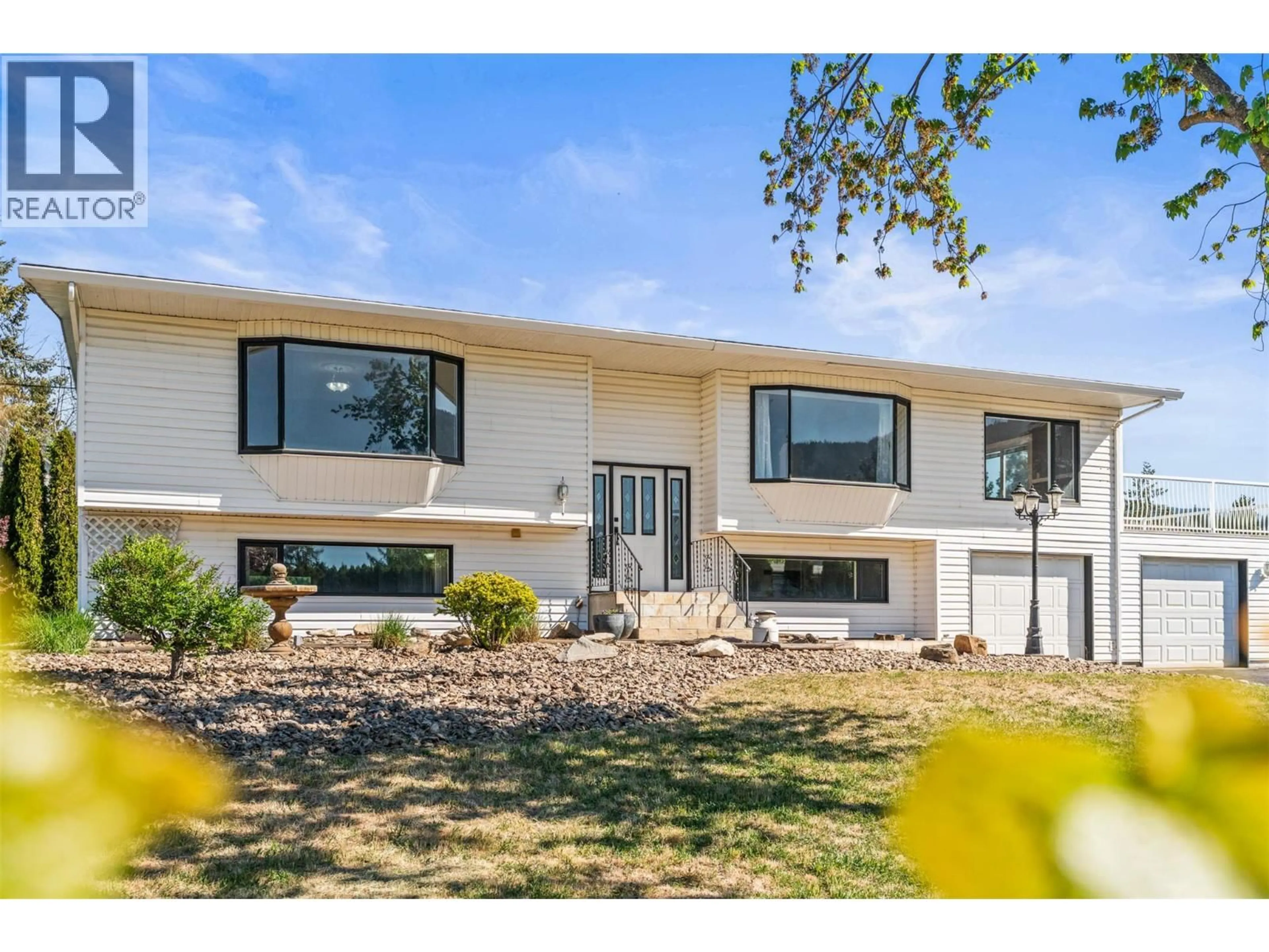 Home with vinyl exterior material, street for 6109 SILVER STAR ROAD, Vernon British Columbia V1B3P3